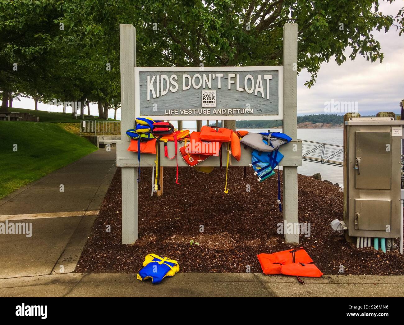 Kids don’t float. Free life vests for kids use in the marina of Sequim, Olympic Peninsula, Washington State, USA. Stock Photo
