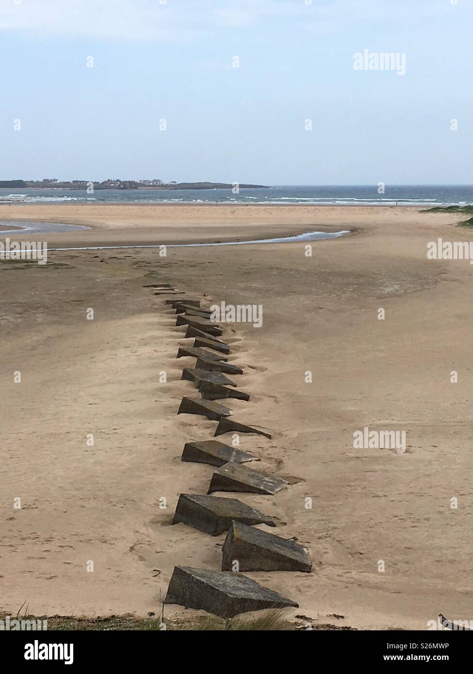 Beach near Beadnell, Northumberland. Anti-tank blocks/traps. Stock Photo