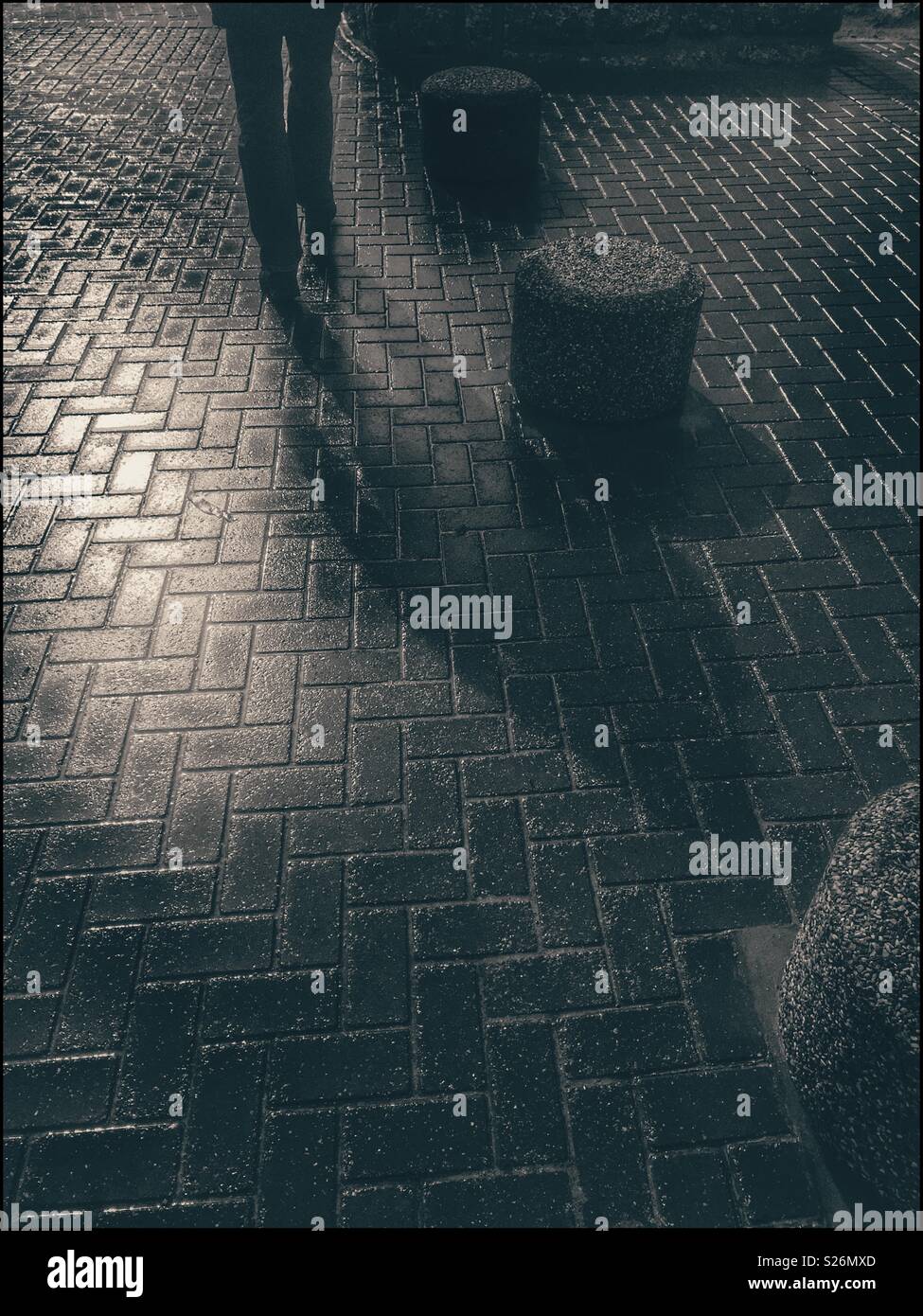 Man walking along Seapoint promenade. - Smartphone Captured Stock Image