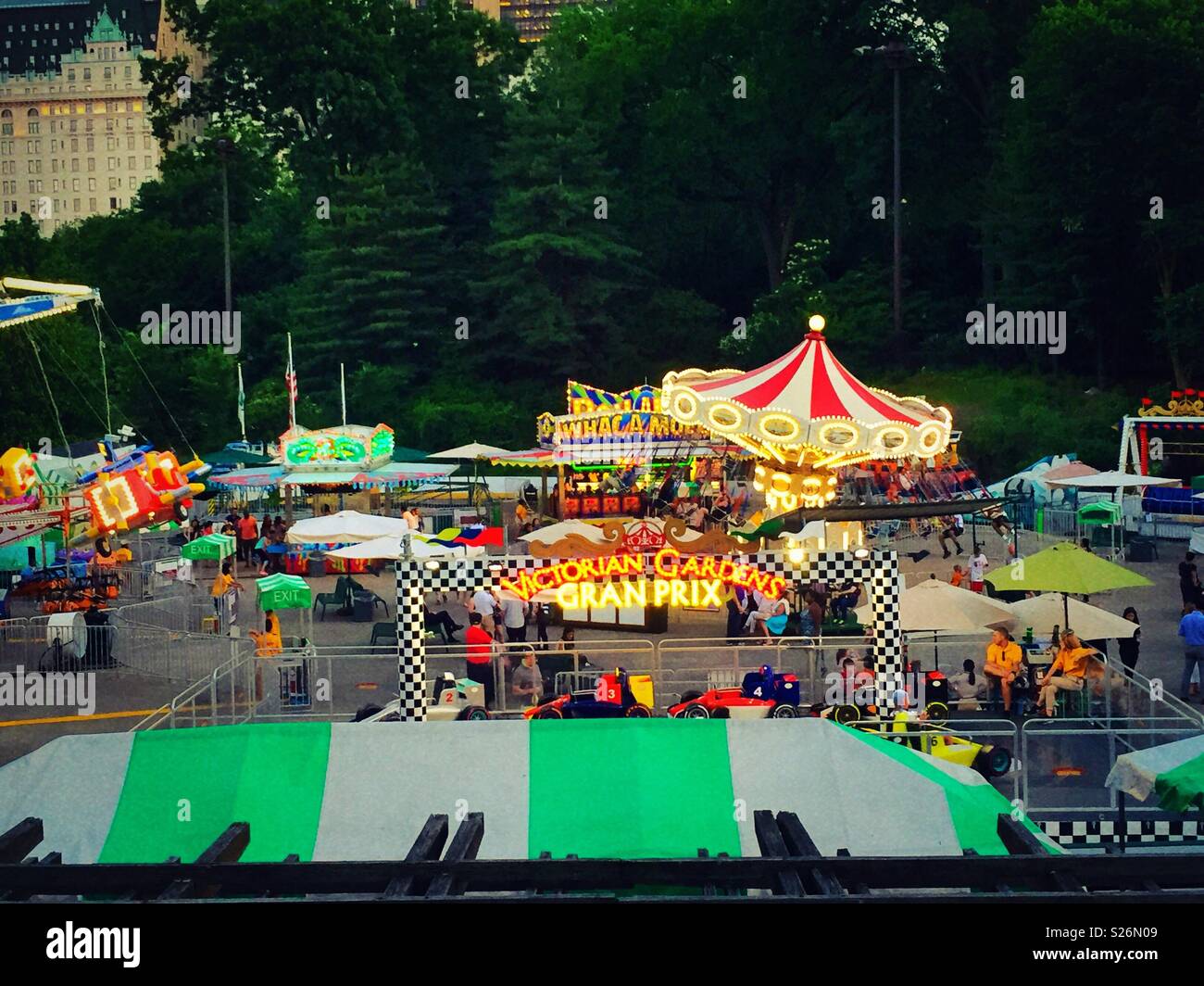 Victorian gardens carnival is an amusement park in the southern part of central park during the summer months, NYC, USA - Smartphone Captured Stock Image