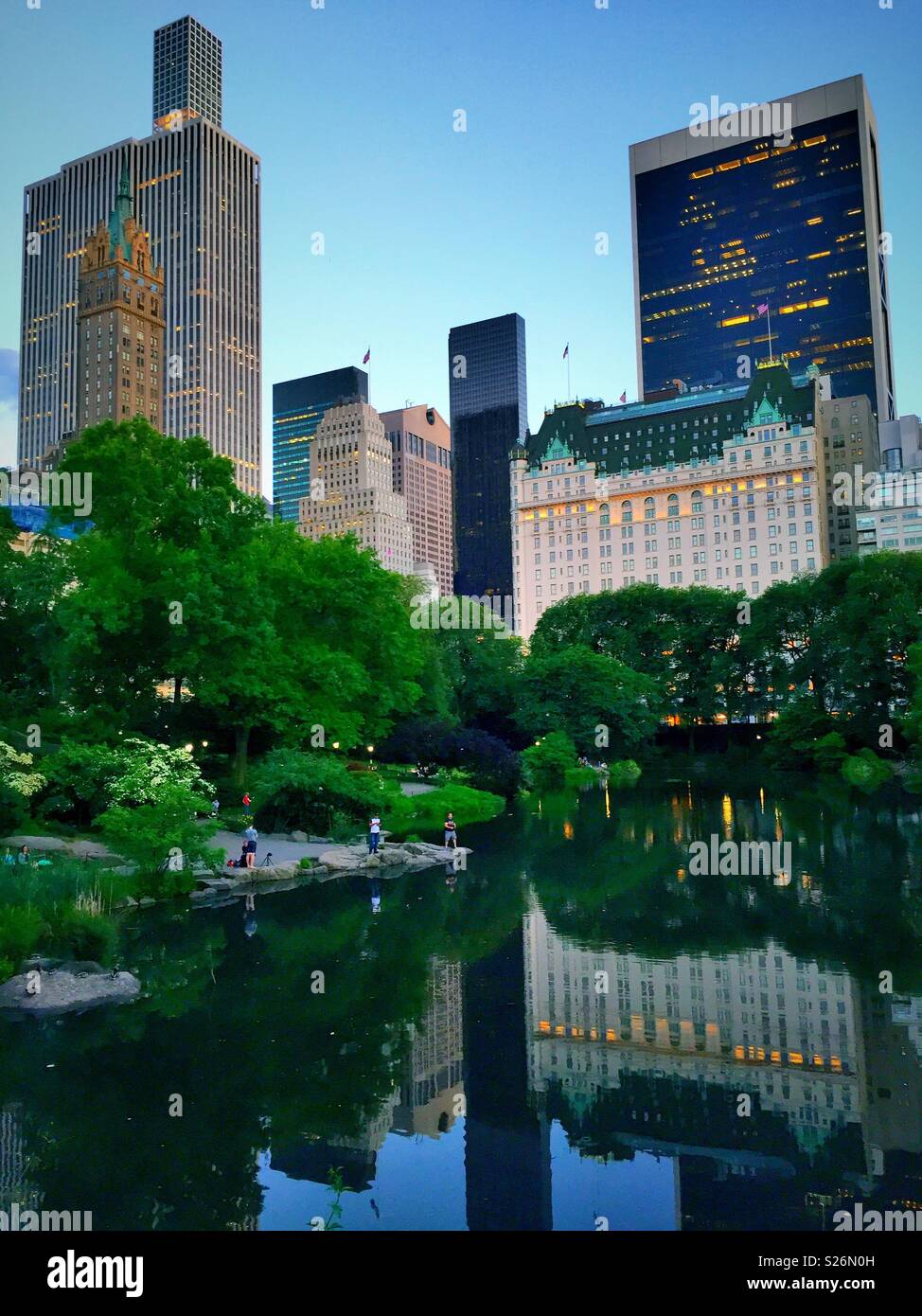 The plaza hotel reflected in Central Park‘s pond, NYC, USA - Smartphone Captured Stock Image