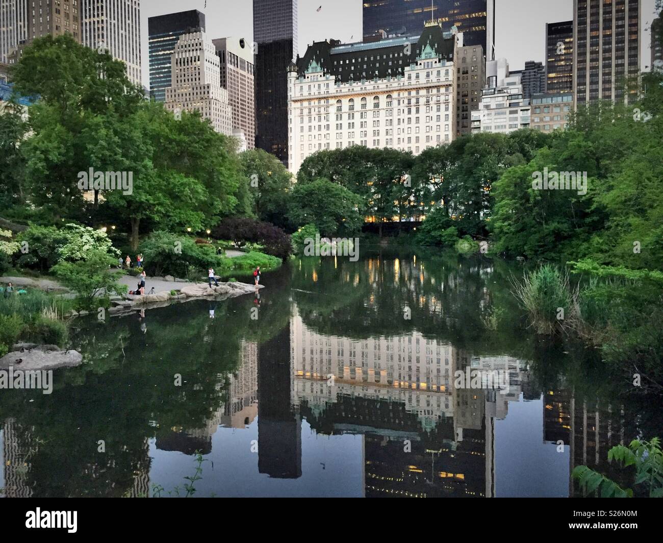 The plaza hotel reflected in Central Park’s pond, NYC, USA - Smartphone Captured Stock Image