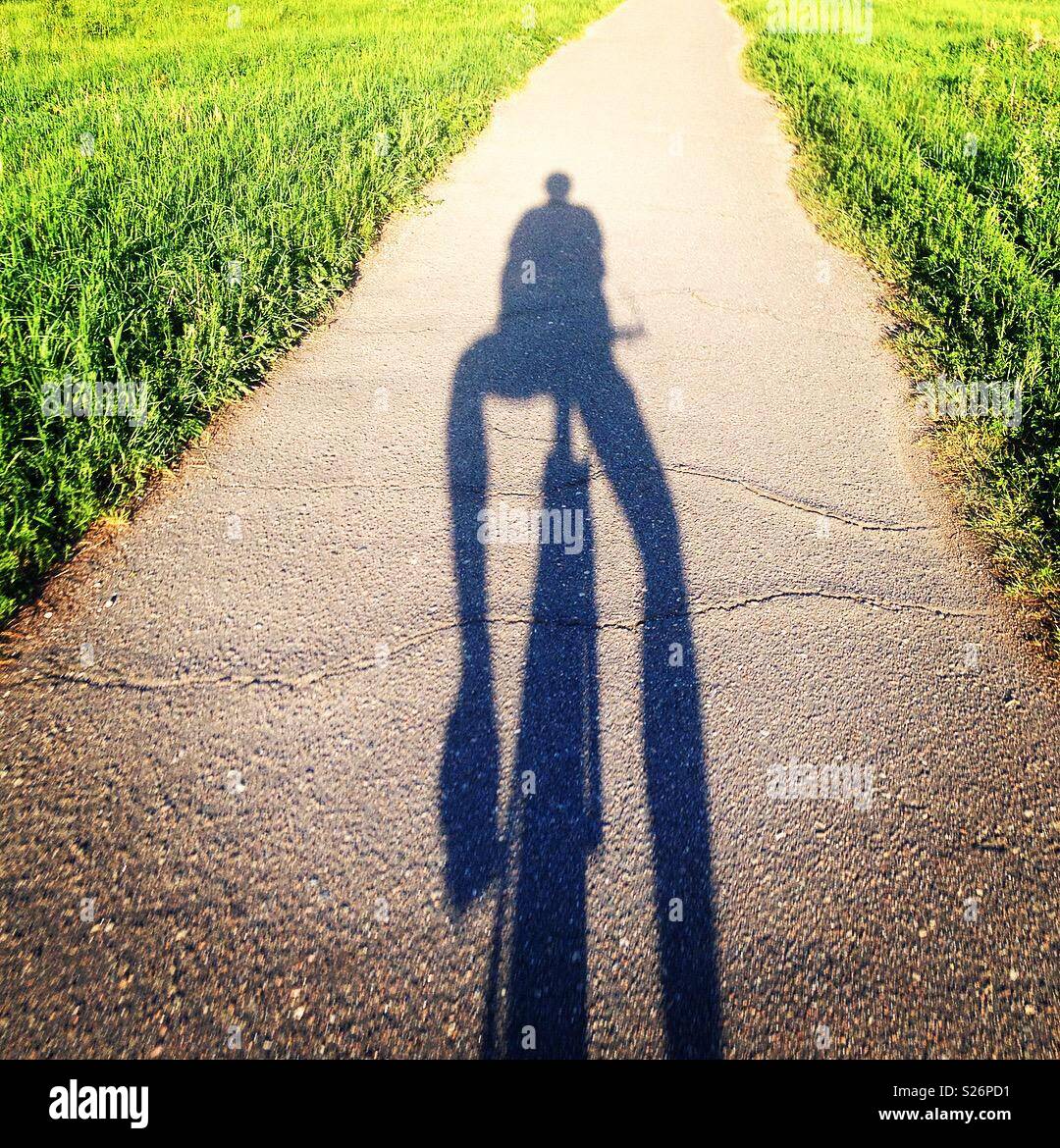 Bicyclist shadow Stock Photo