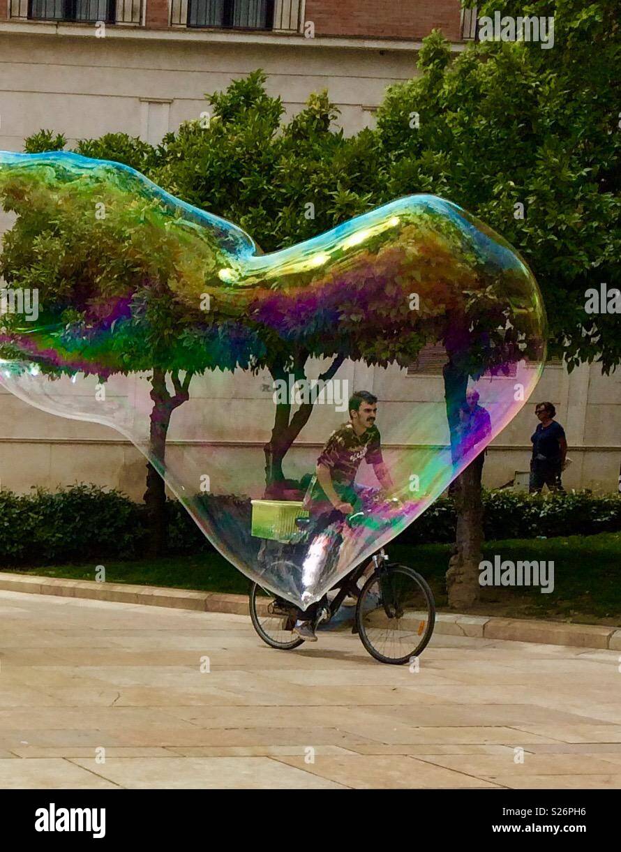 Cyclist caught in a bubble Stock Photo Alamy