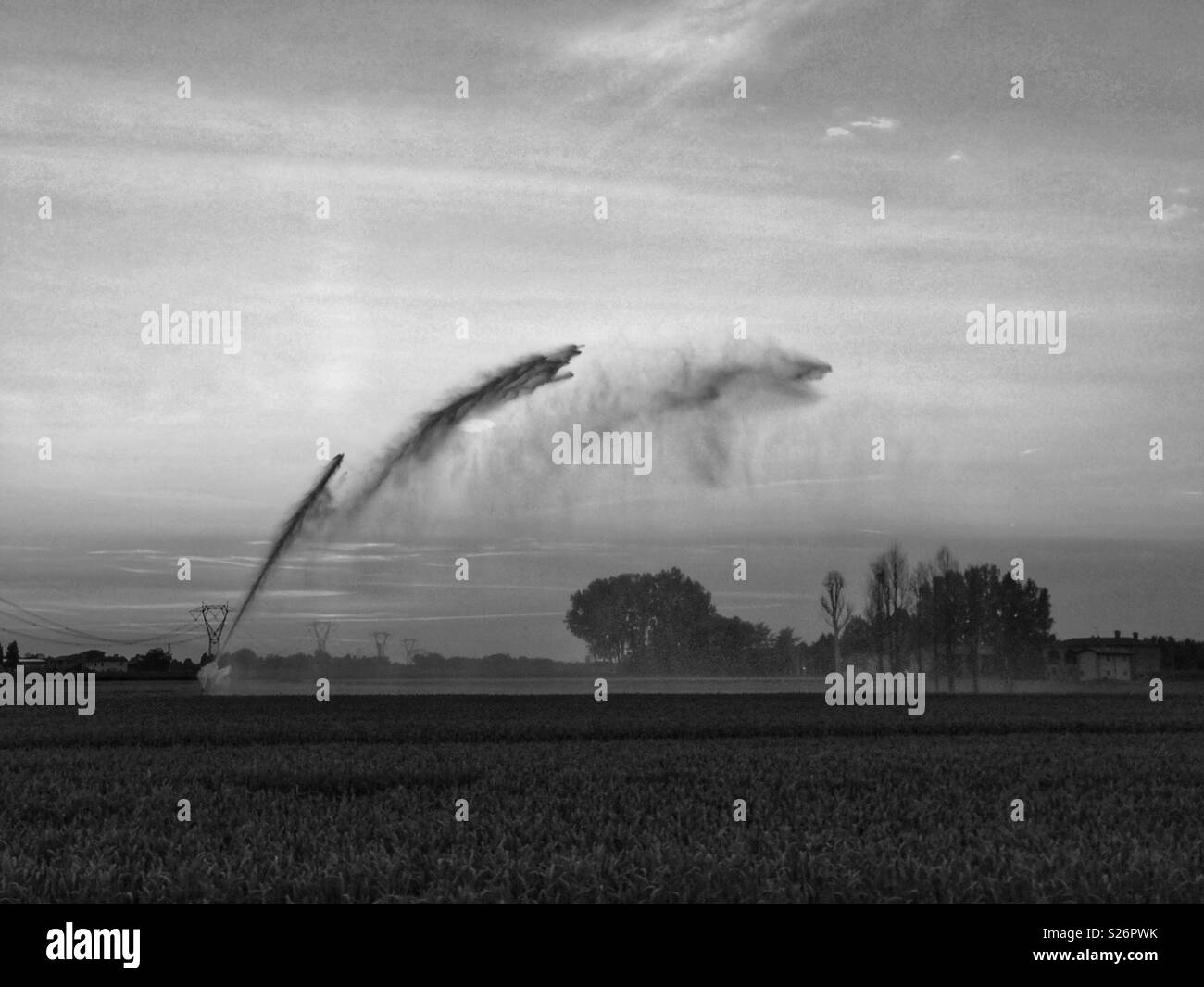 Irrigating the thirsty land in summer Stock Photo