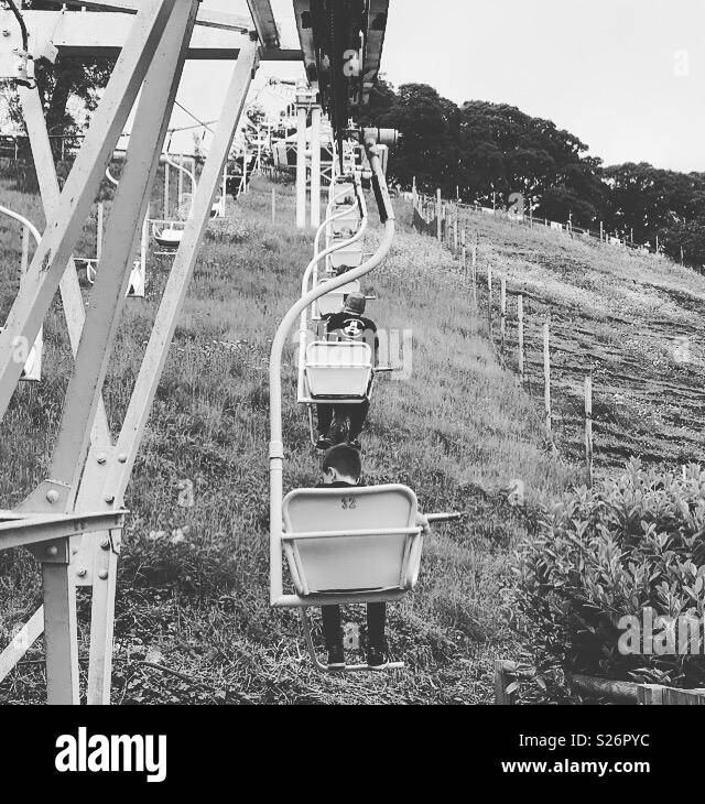 View of people on Dudley Zoo chairlift. Stock Photo