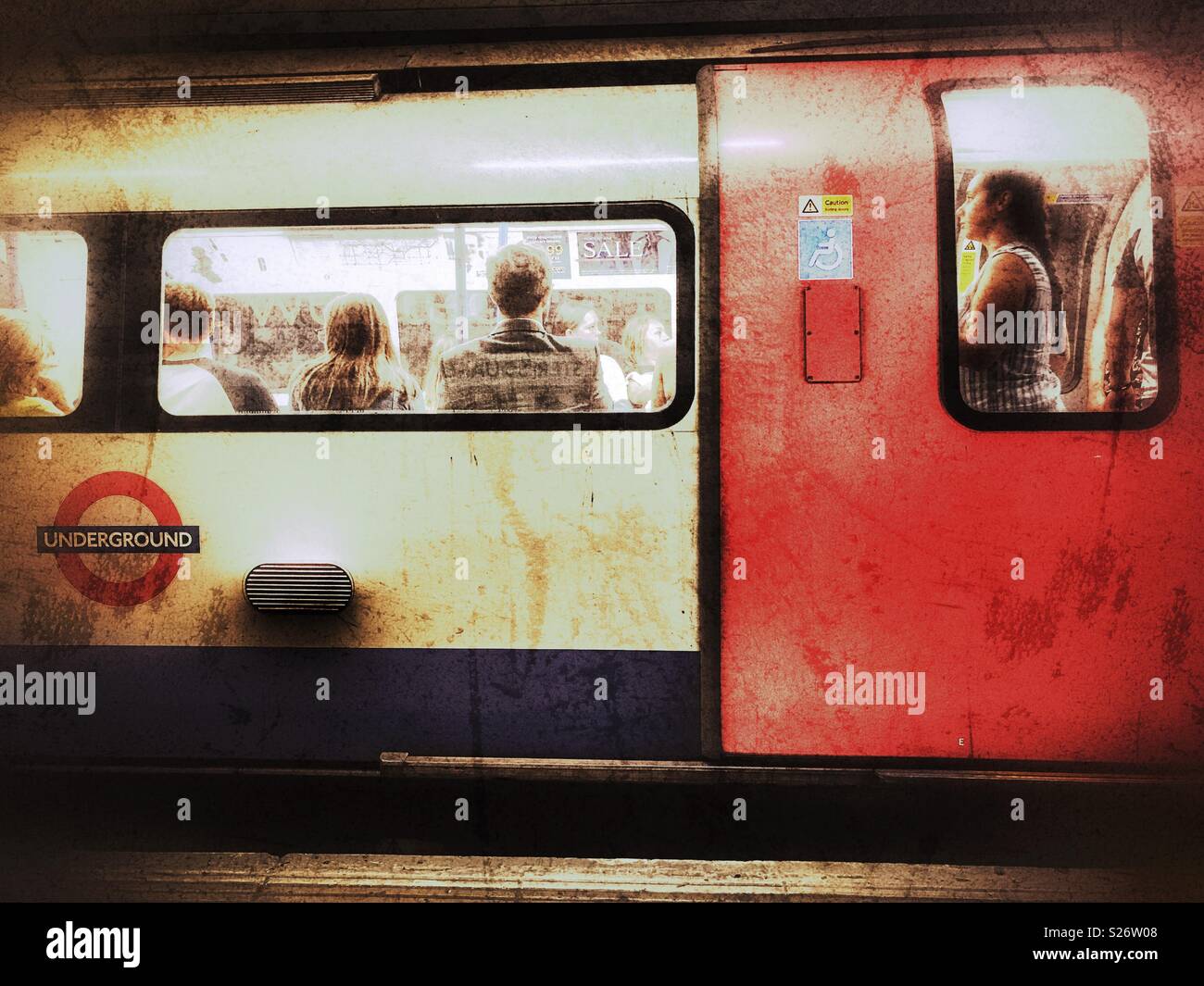 London Underground, People on a Northern Line tube train, Leicester Square tube station, London, England - Smartphone Captured Stock Image