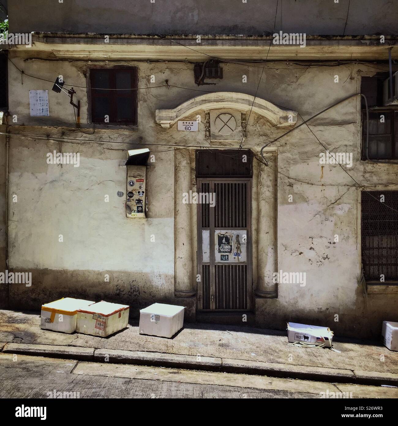 Entrance in Peel Street to an old-style walk-up apartment block on Hollywood Road, Central, Hong Kong - Smartphone Captured Stock Image