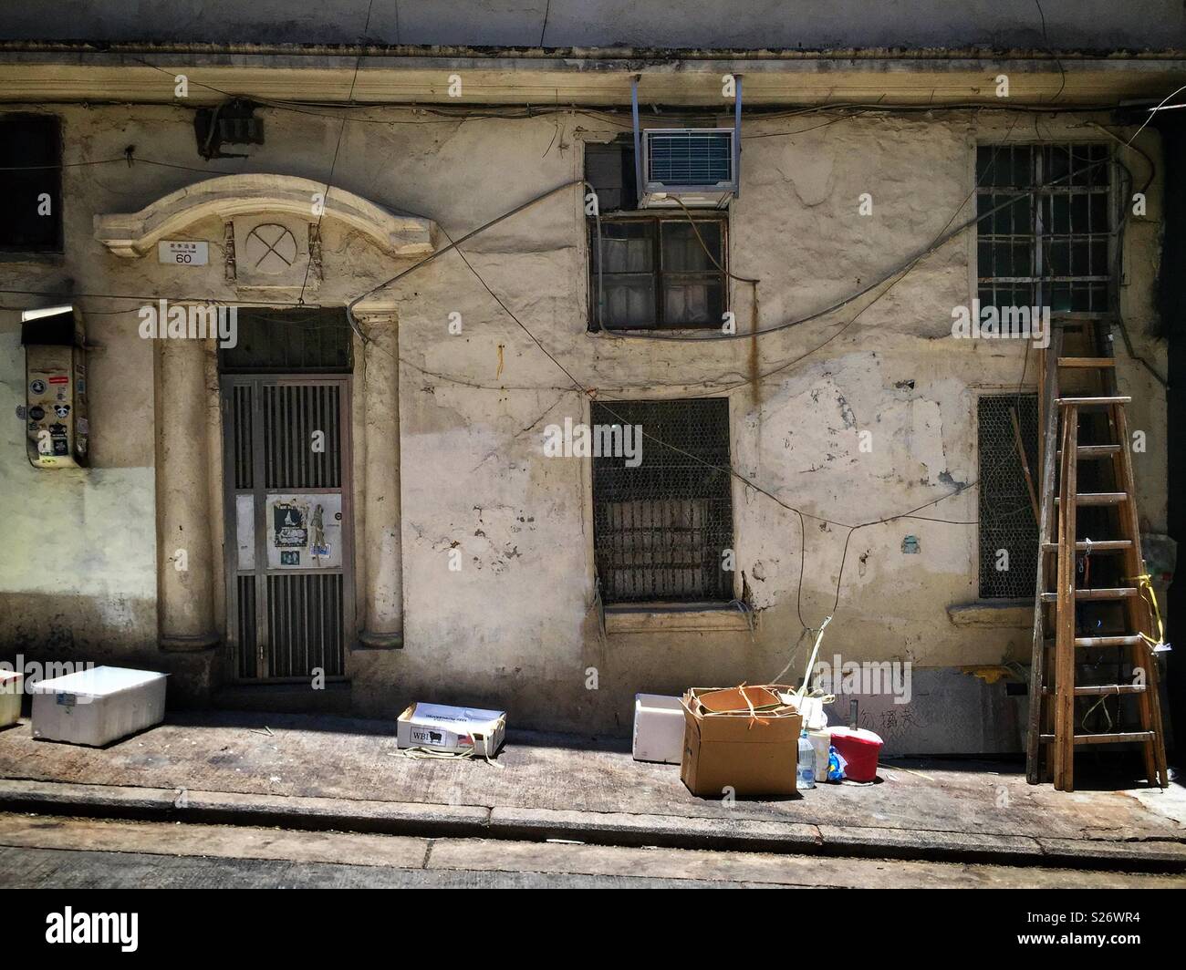 Entrance in Peel Street to an old-style walk-up apartment block on Hollywood Road, Central, Hong Kong - Smartphone Captured Stock Image