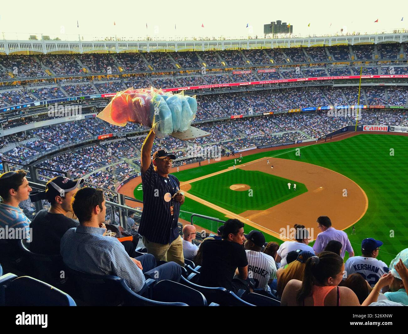 Cotton candy vendor at a night game in Yankee Stadium, NYC, USA - Smartphone Captured Stock Image