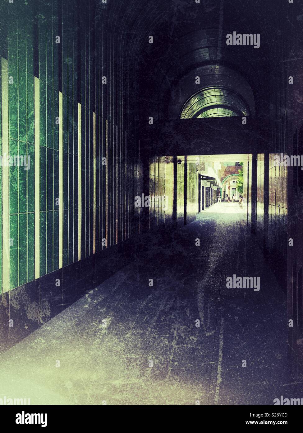 Grunge atmospheric dark arched passageway Stock Photo