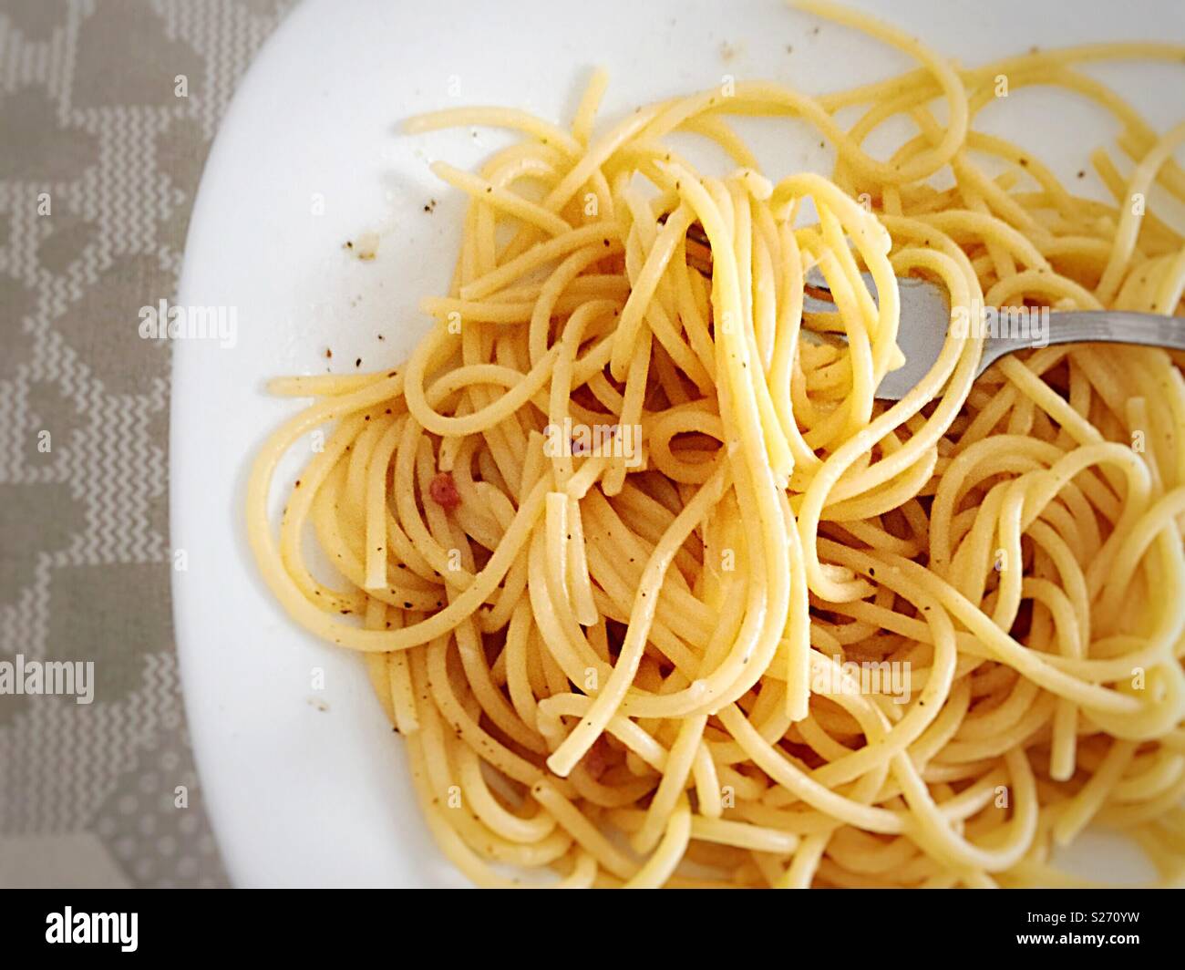 Spaghetti portion on a white plate - Smartphone Captured Stock Image