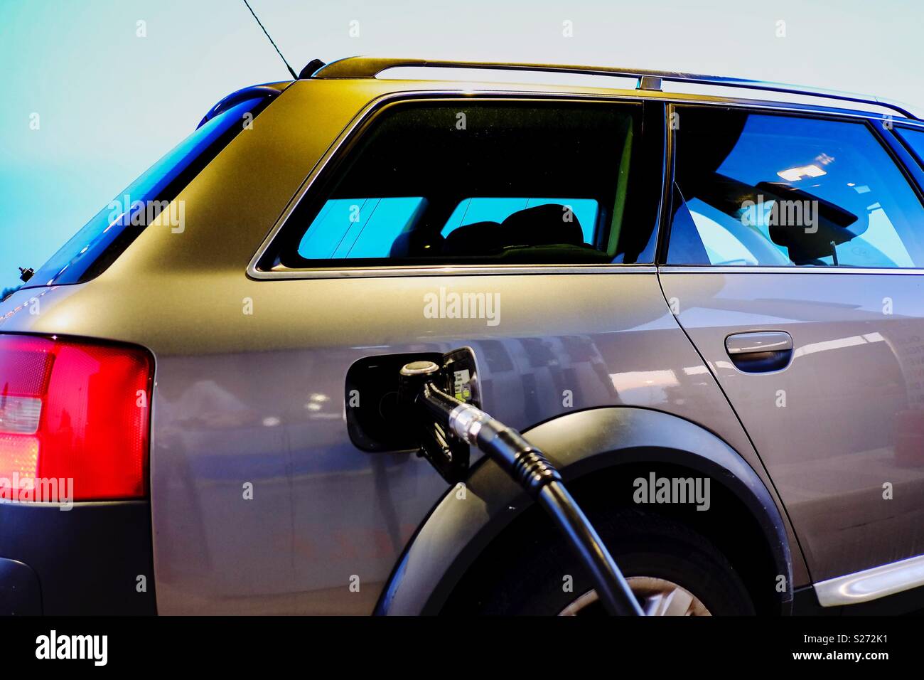 Refueling the car with diesel pump in the station - Smartphone Captured Stock Image