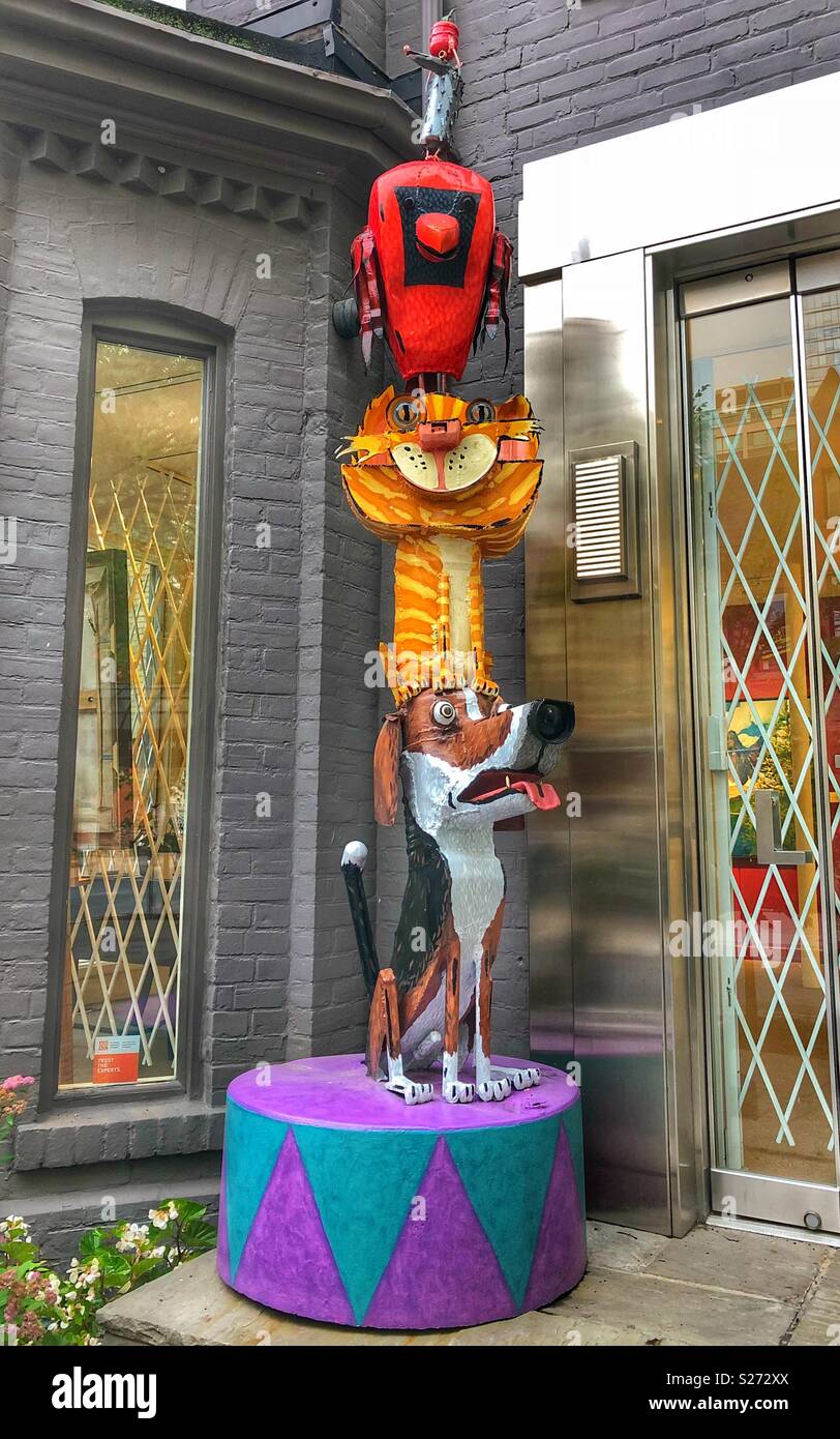 Dog, cat and bird metal sculpture. - Smartphone Captured Stock Image