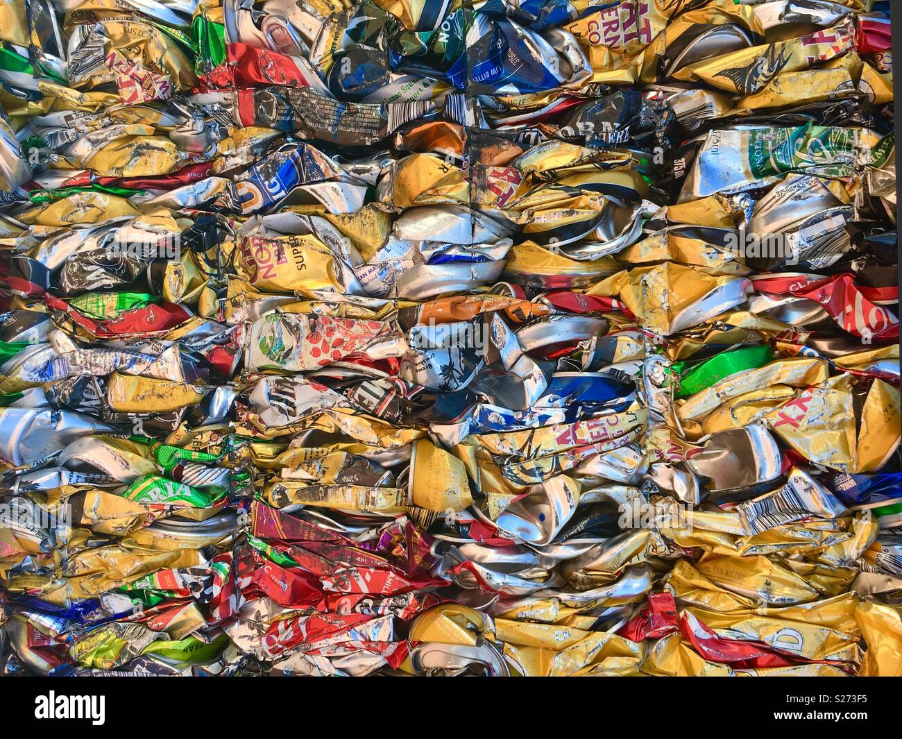 Crushed and compressed aluminium cans for recycling. Stock Photo