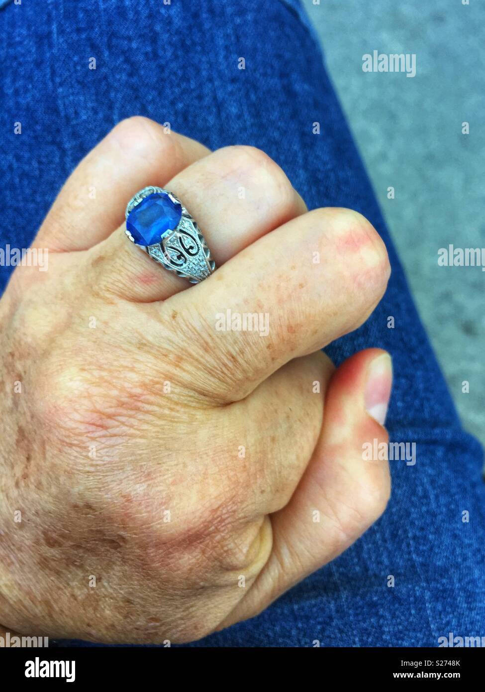 Closeup of left hand cracking knuckle - Smartphone Captured Stock Image