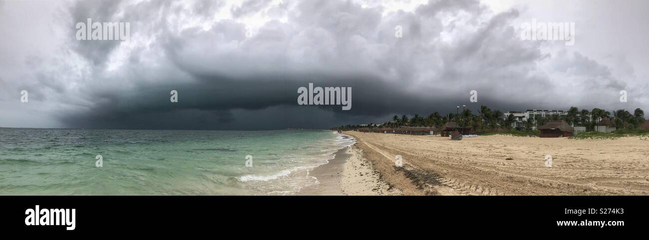 Panorama of a huge storm gust front as it works its way up the beach. Taken in Playa Mujeres, near Cancun, Mexico. - Smartphone Captured Stock Image