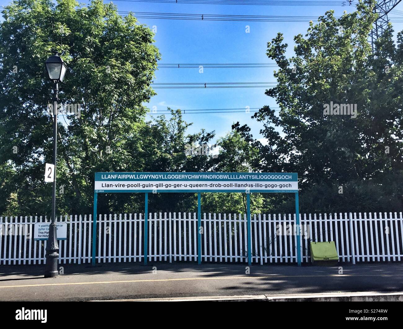 Longest place name in UK, Llanfairpwllgwyngyll, on Anglesey, train station sign. - Smartphone Captured Stock Image