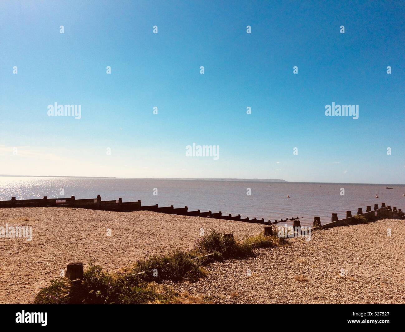 Whitstable beach in summer with beautiful blue sky - Smartphone Captured Stock Image