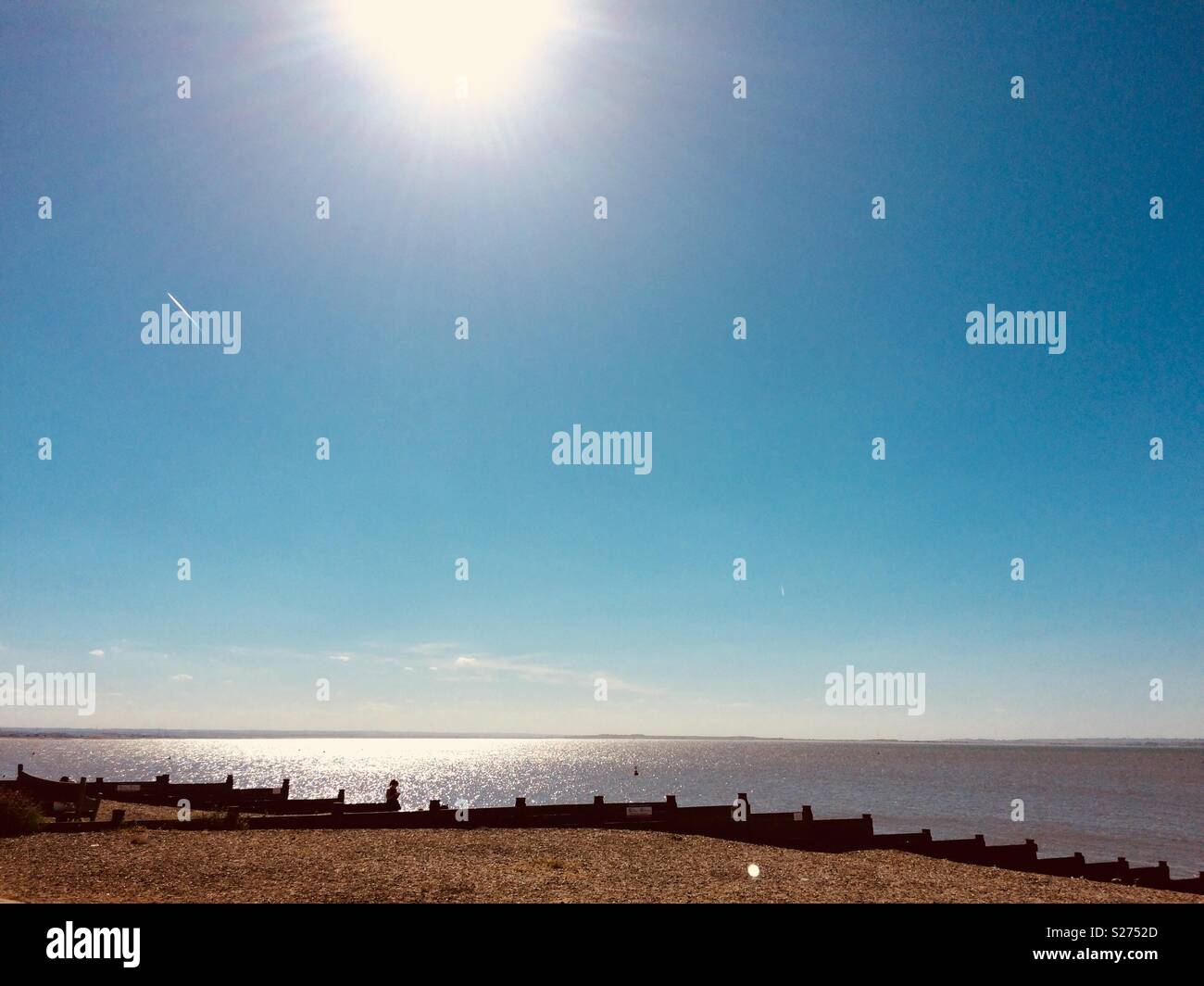 Afternoon sun over sea at Whitstable, Kent, in June - Smartphone Captured Stock Image