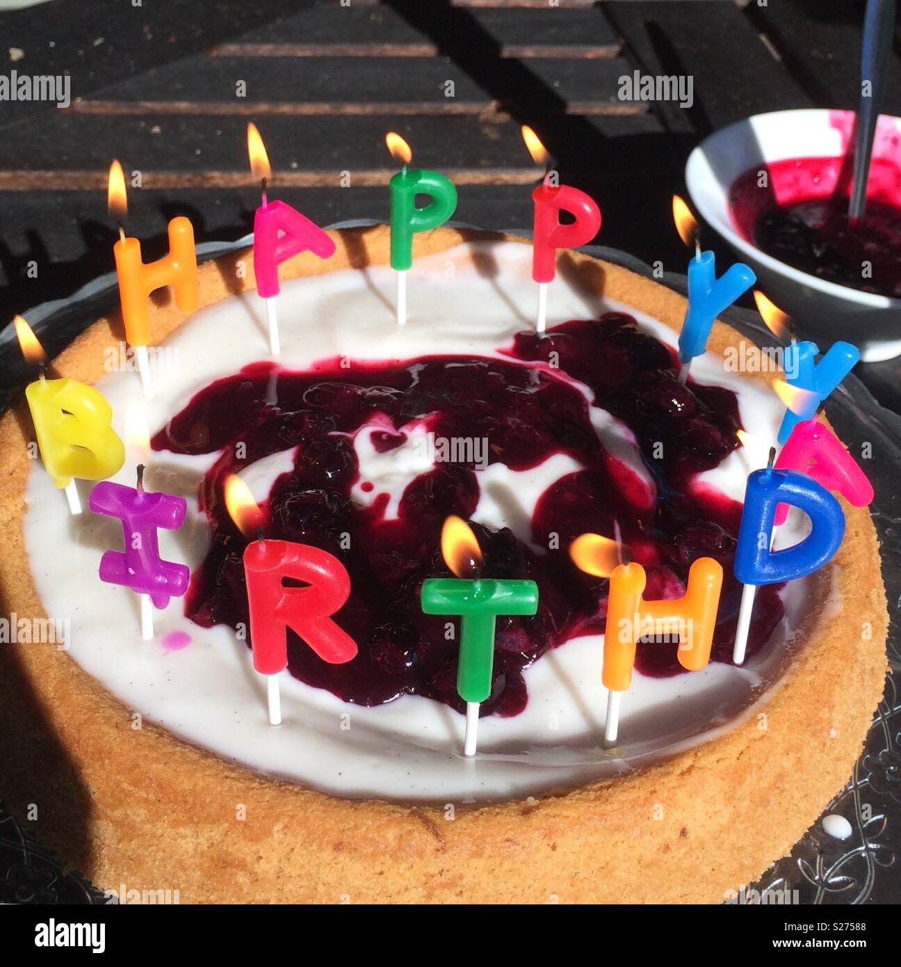 Birthday cake with candles lit hires stock photography and images Alamy