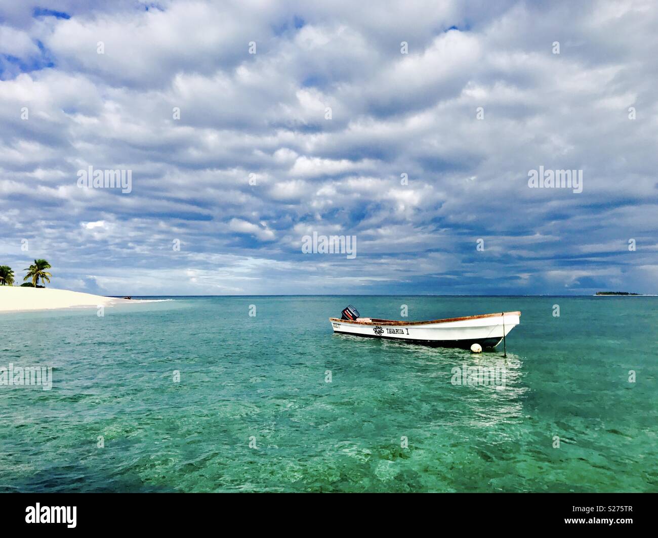 A boat anchored off Tavarua Island. Fiji. - Smartphone Captured Stock Image