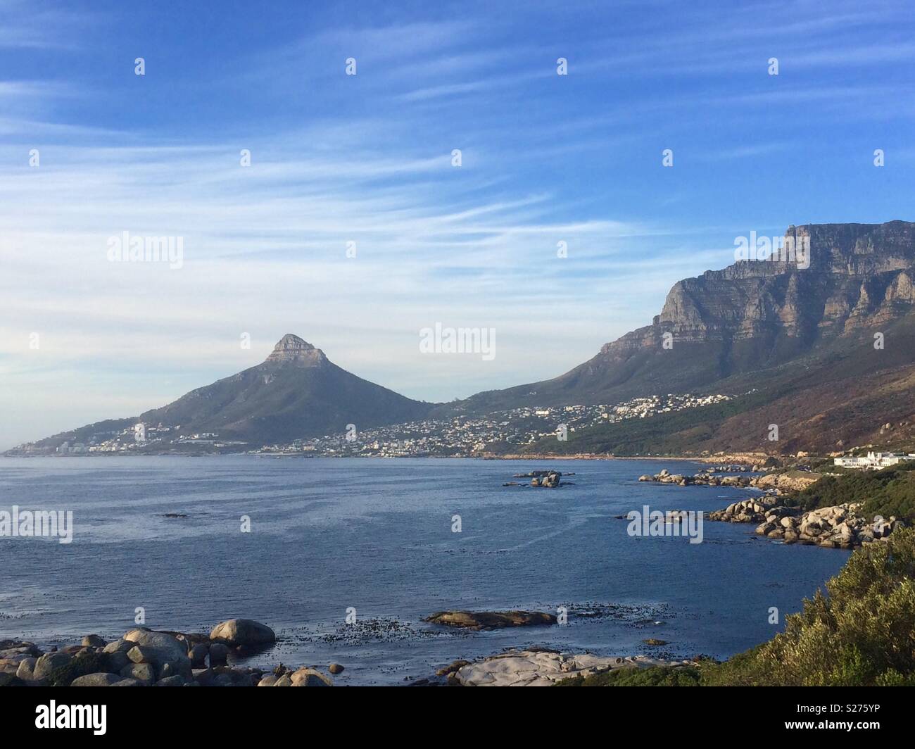 Landscape of Lions Head and back of Table Mountain across the sea and looking at Camps Bay an upmarket suburb of Cape Town concept travel and tourism - Smartphone Captured Stock Image