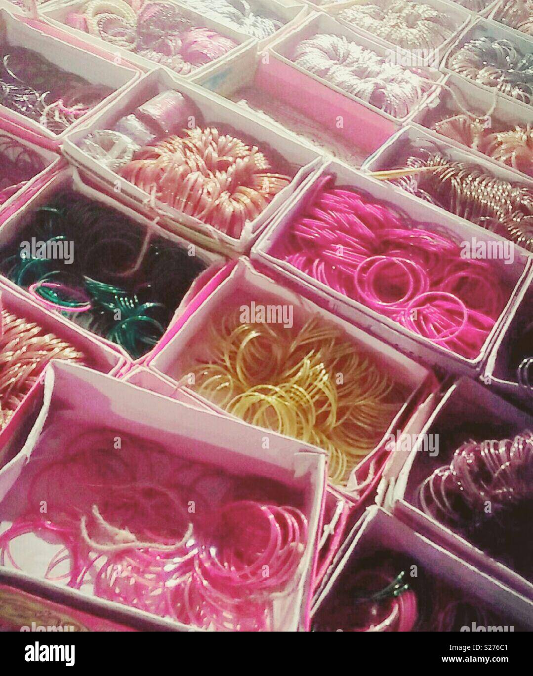 Beautiful collections of Bangles to pick from all colours and sizes. These are openly displayed in the Bazar which is based in Lahore, Pakistan Stock Photo