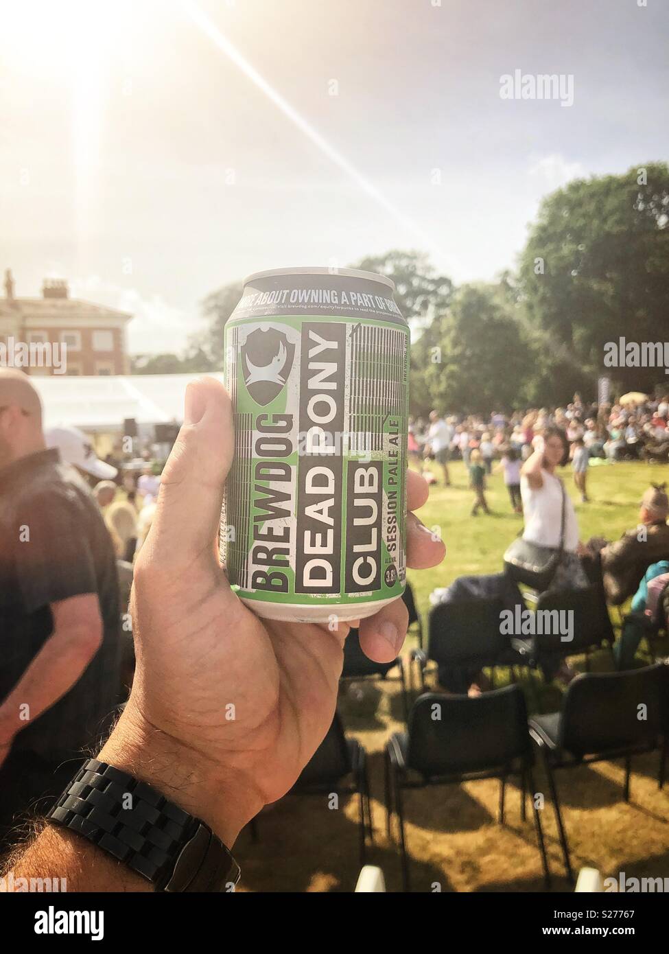 Brewdog’s dead pony club can of beer, enjoyed at a festival. Credit: Lee Ramsden / Alamy Stock Photo