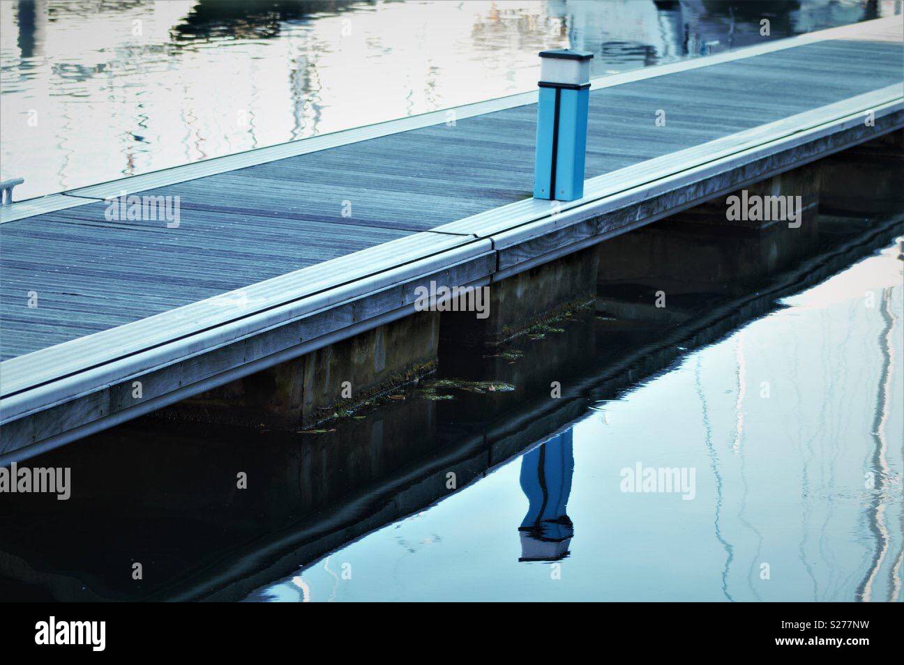 Blue post water reflection Stock Photo Alamy