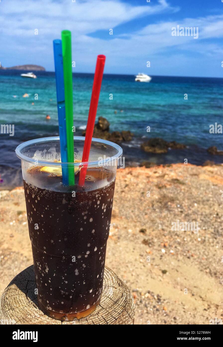 Cold coke with a beautiful beach and sea view Stock Photo
