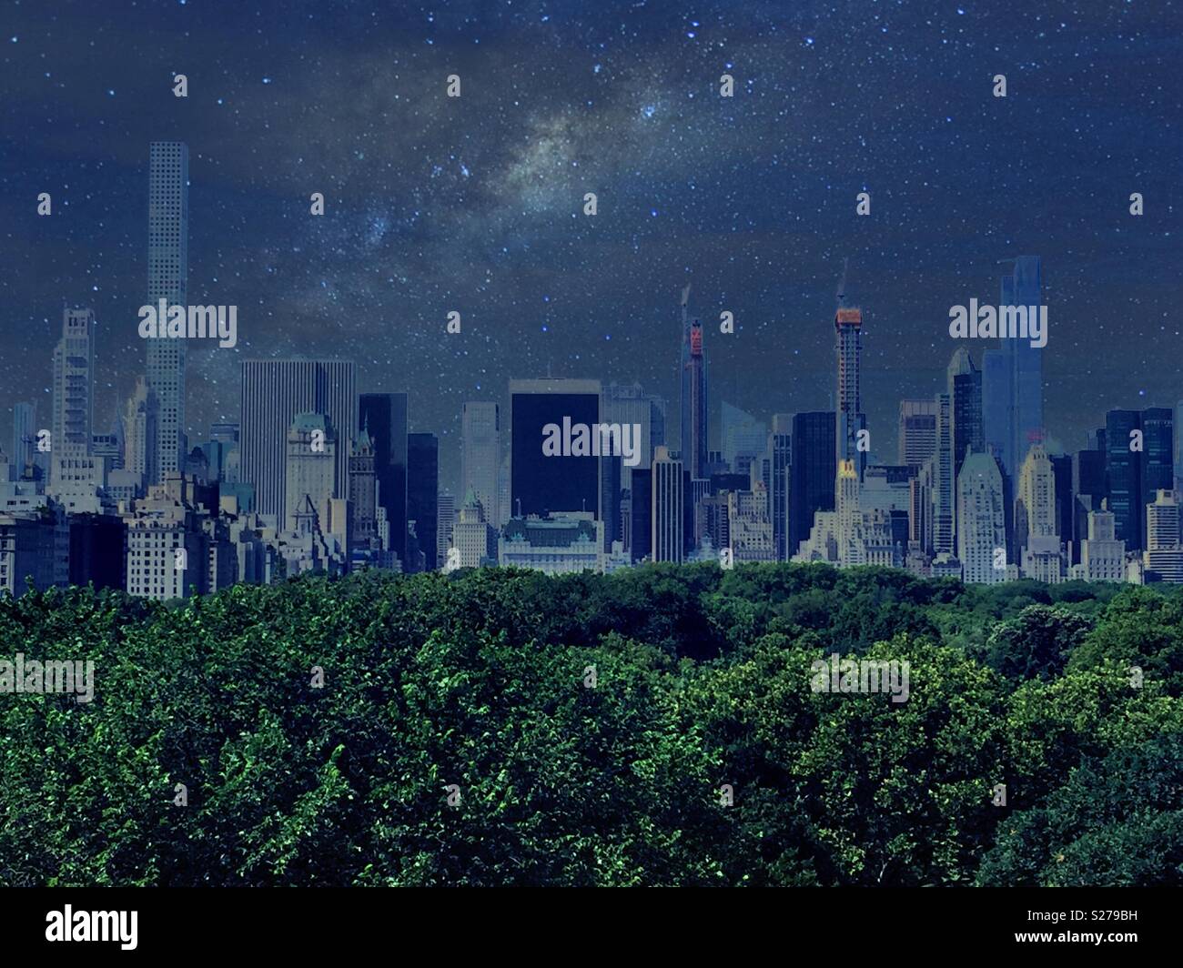 Night time image of midtown Manhattan skyline with Central Park trees in the foreground, NYC, USA - Smartphone Captured Stock Image