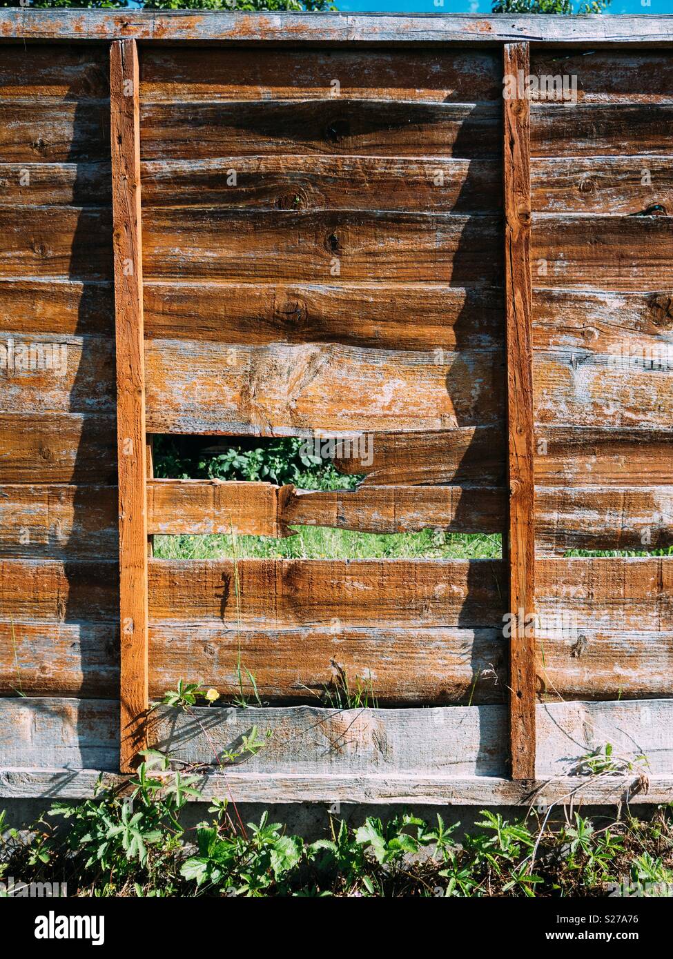Broken wooden fence panel Stock Photo