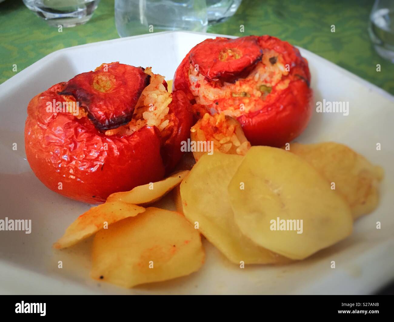 Baked tomatoes with rice and sliced potatoes - Smartphone Captured Stock Image