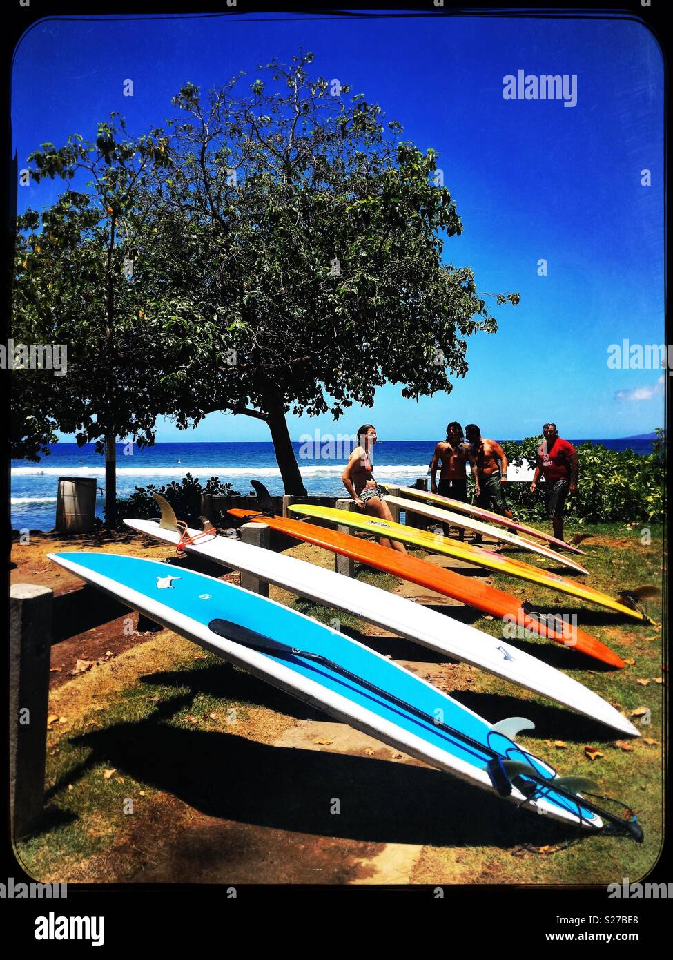 Break time after hours of fun endless morning surf, summer swells in Maui, the beach parks and surf breaks are full of colorful surfboards , beautiful friends and laughter! Feeling so grateful!!! Stock Photo
