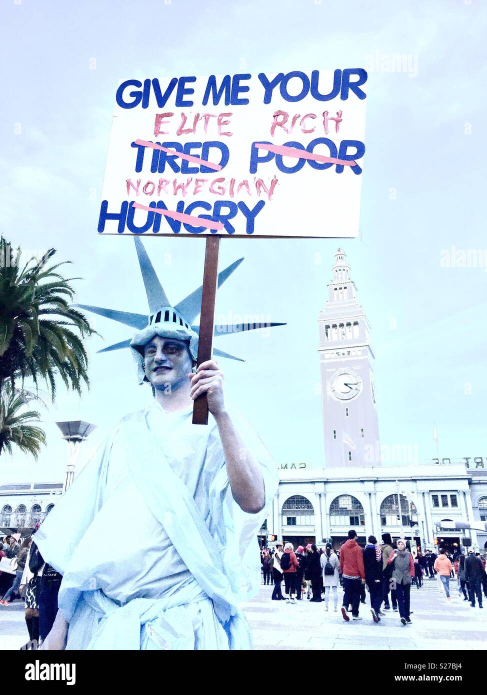 Protester dressed as Statue of Liberty with a black eye at the 2018 Women's March in San Francisco, California, USA. - Smartphone Captured Stock Image