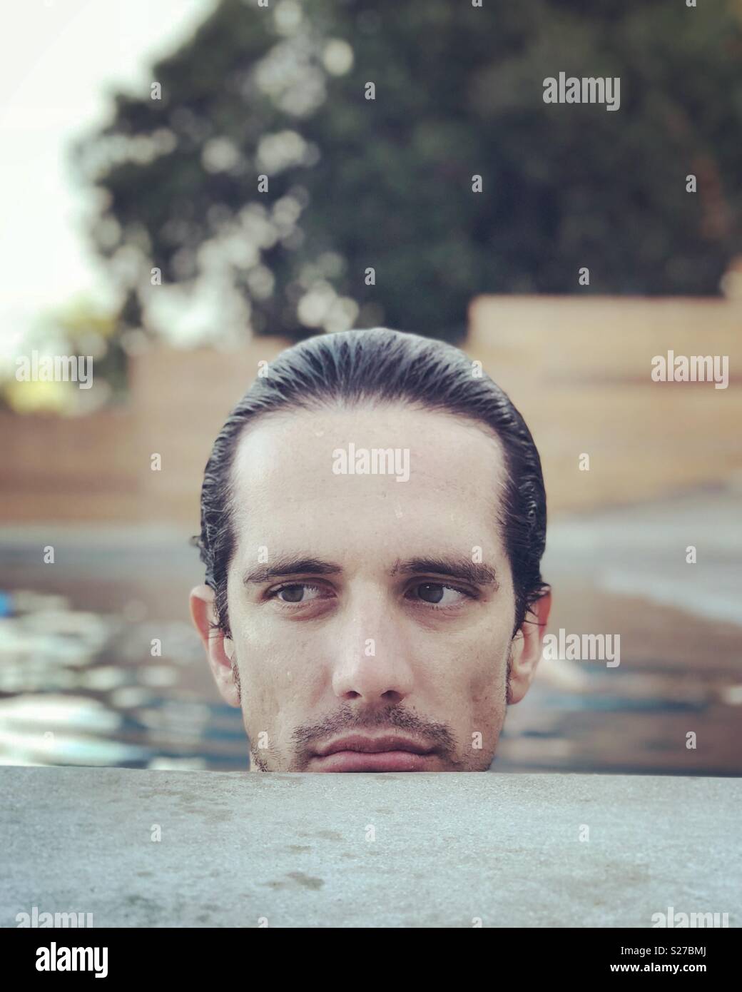Man in pool - Smartphone Captured Stock Image