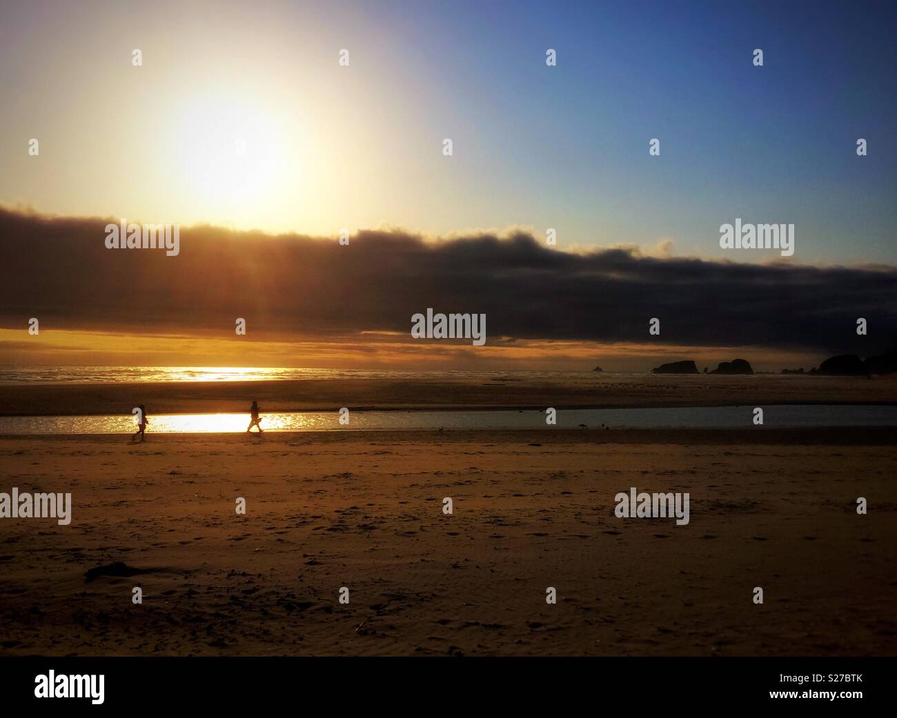 Walking on the beach at sunset, Cannon Beach, Oregon, USA. - Smartphone Captured Stock Image
