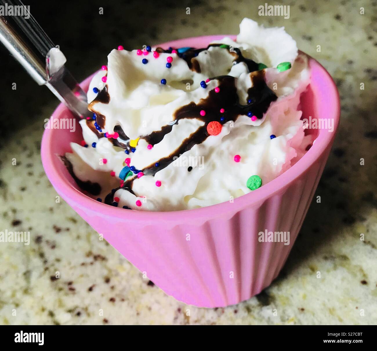 Ice Cream with whipped cream, sprinkles & chocolate syrup! Stock Photo