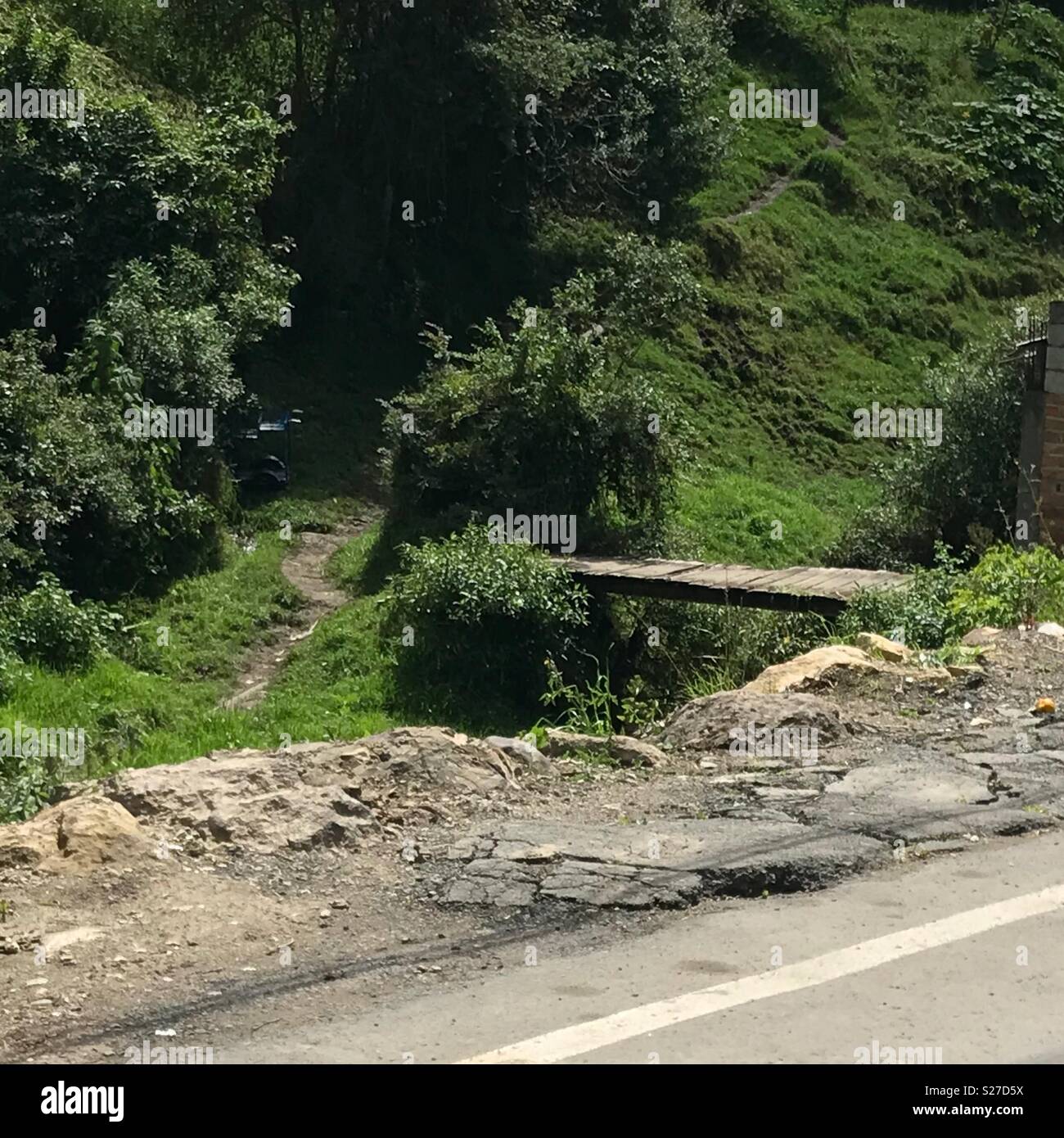 Bridge over creek in Ecuador Stock Photo