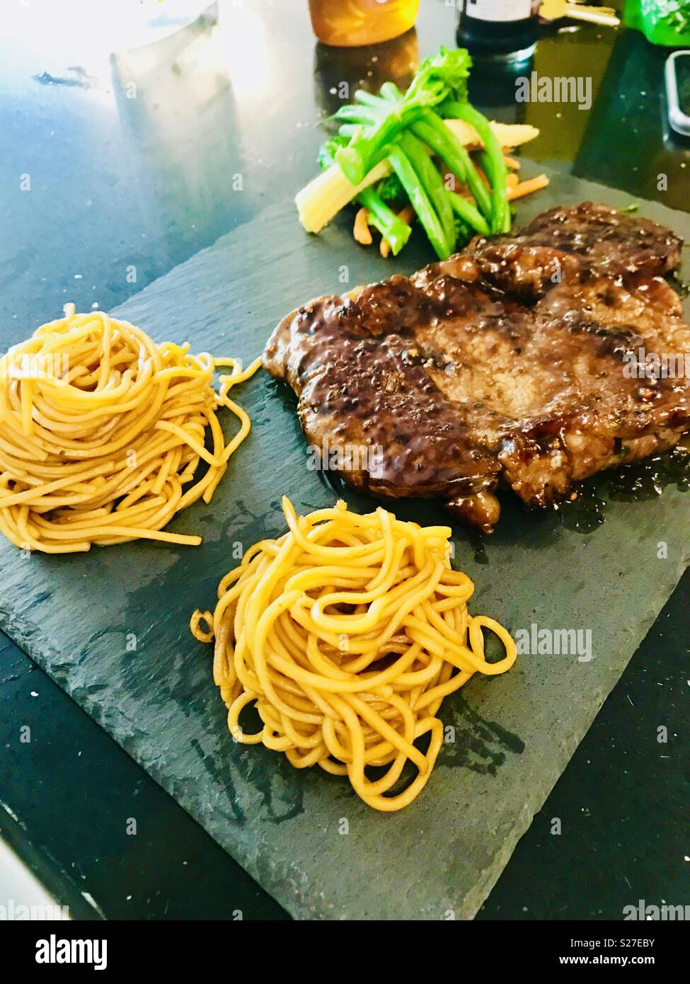 Homemade flatiron steak and noodles Stock Photo - Alamy