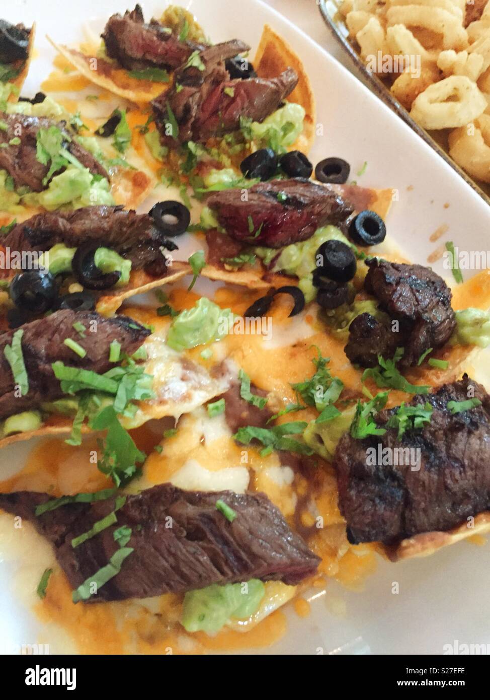 Gourmet steak nachos at upscale Tex-Mex restaurant, NYC, USA - Smartphone Captured Stock Image Gourmet steak nachos at upscale Tex-Mex restaurant, NYC, USA - Smartphone Captured Stock Image
