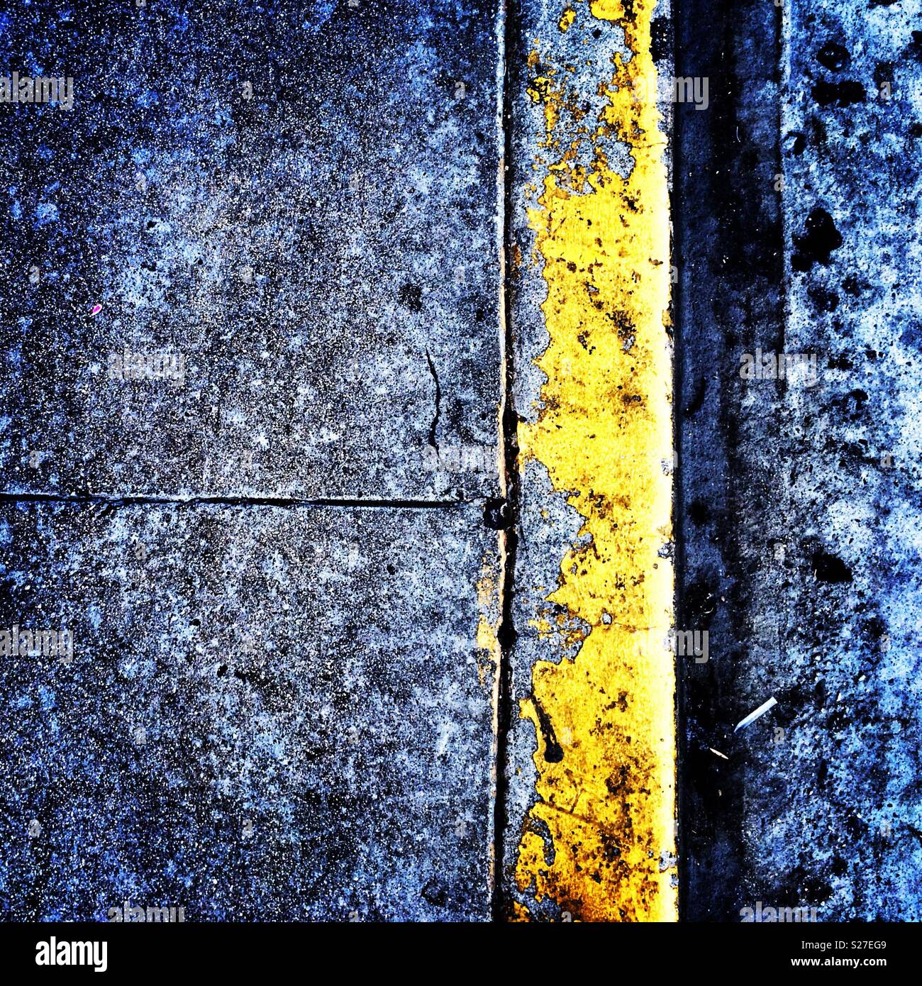 A Yellow Curb And Texture Of Concrete Where A Sidewalk Meets The Gutter A Yellow Curb And Texture Of Concrete Where A Sidewalk Meets The Gutter