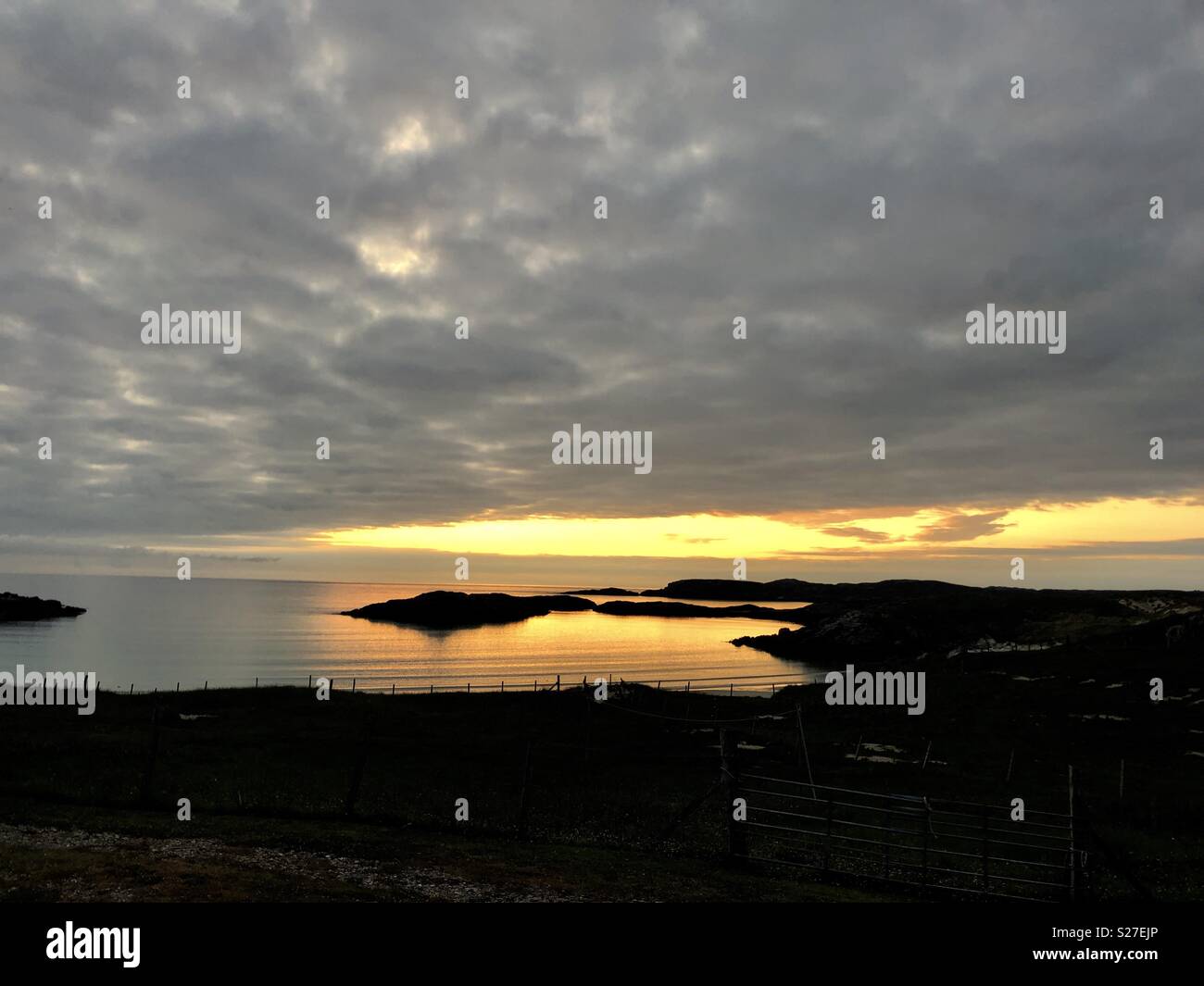Calming sea and sunset colours over Carnish, Isle of Lewis in June - Smartphone Captured Stock Image
