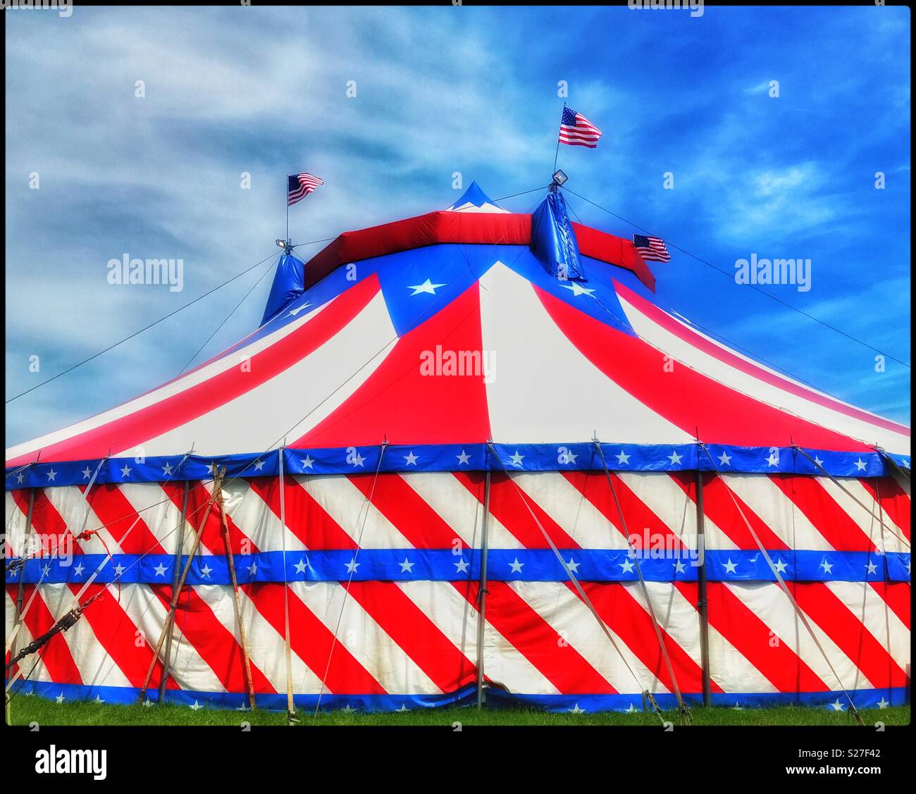 The distinctive colours of America - in this case making up a Circus Tent. It’s summer, the sun is shining and it’s time for Circus entertainment. Photo Credit - © COLIN HOSKINS. - Smartphone Captured Stock Image