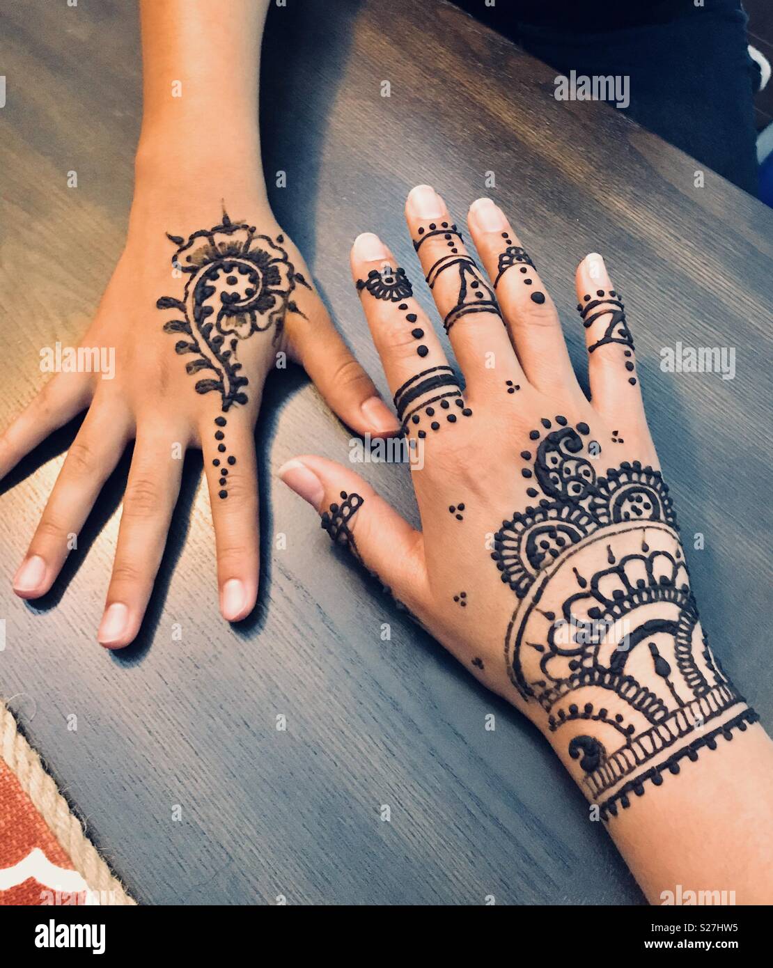 Mother daughter henna Stock Photo