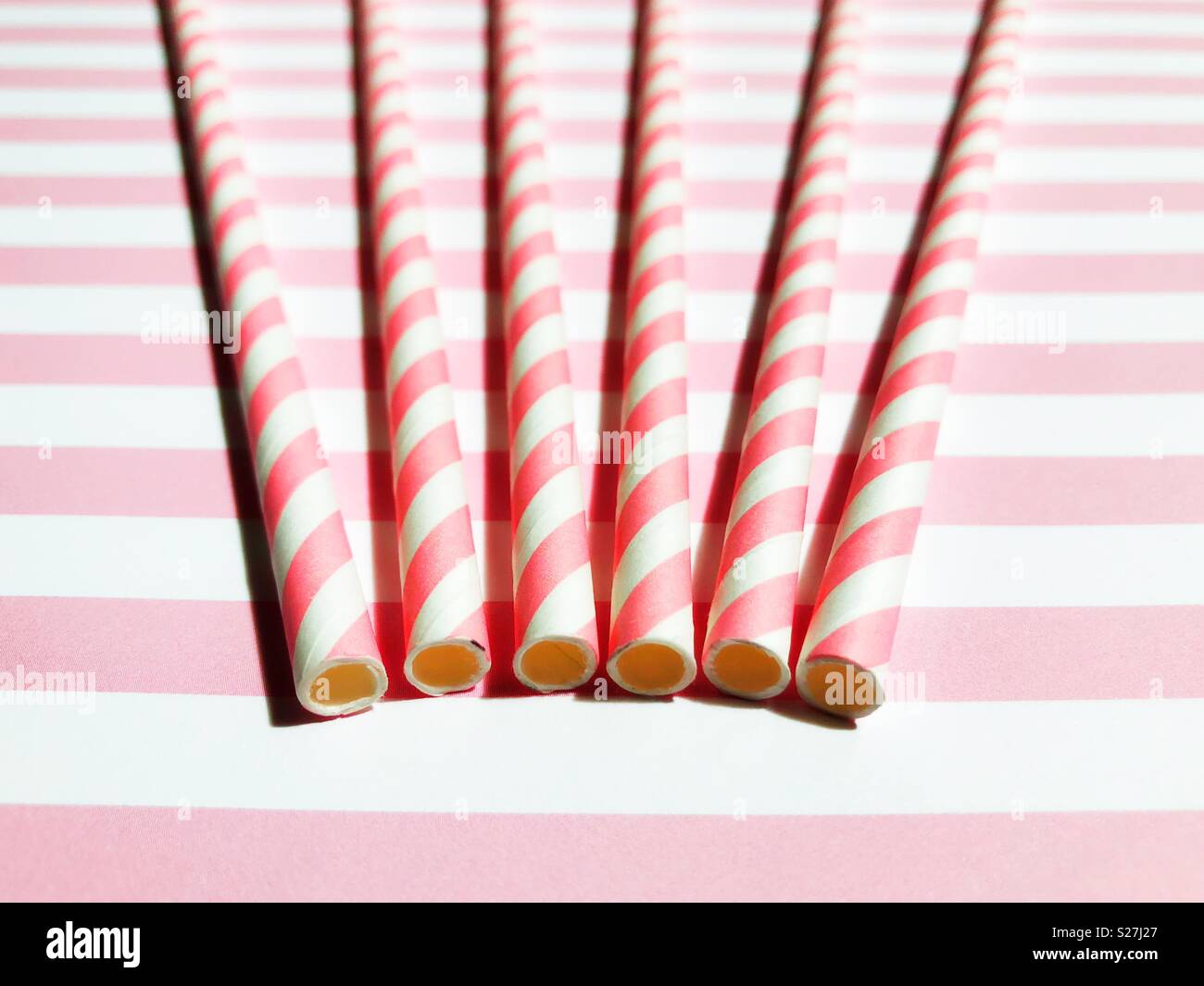 Pink and white striped paper straws Stock Photo - Alamy