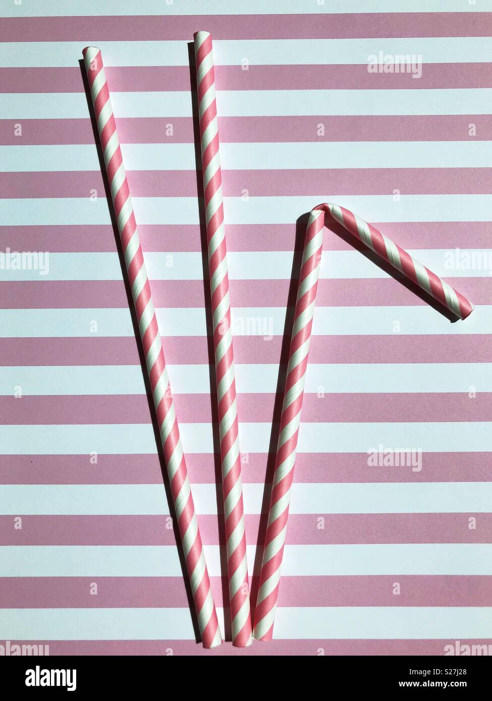 Pink and white striped paper straws Stock Photo - Alamy