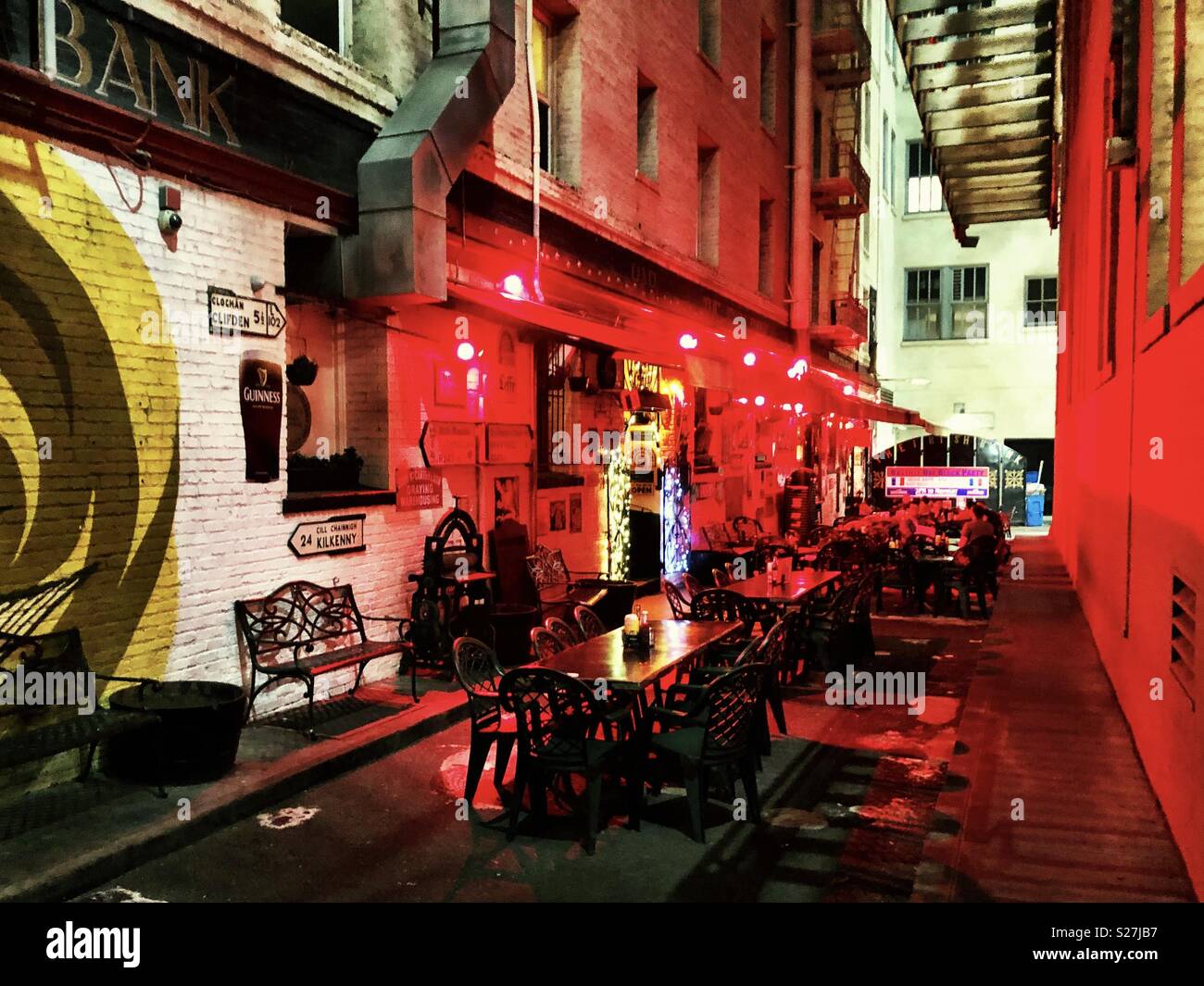 San Francisco local nightlife at the Irish Bank pub, outdoor alleyway tables - Smartphone Captured Stock Image