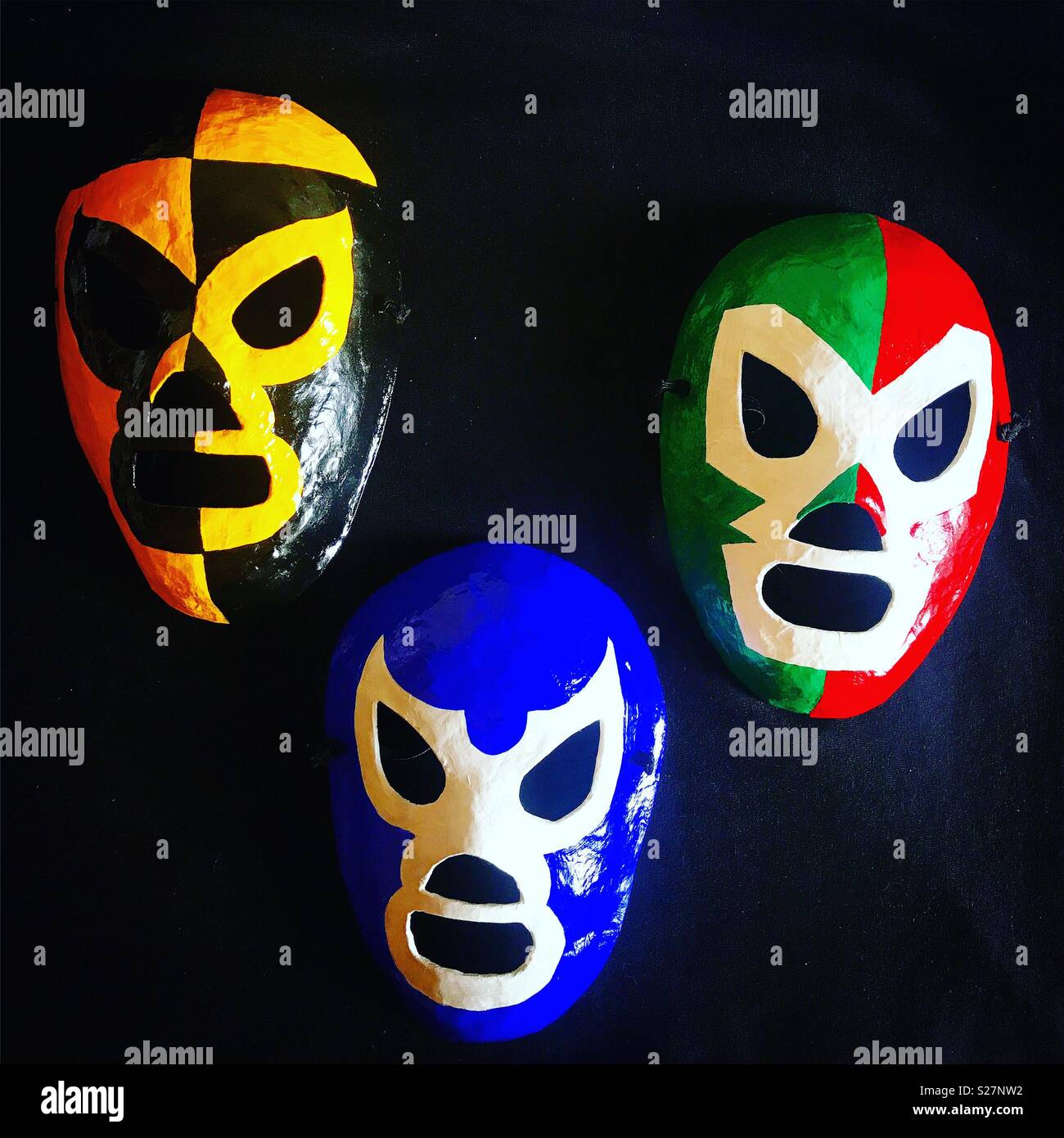 Colored mask of Mexican wrestlers decorate Tlamaxcalli toys workshop in Colonia Roma, Mexico City, Mexico Stock Photo